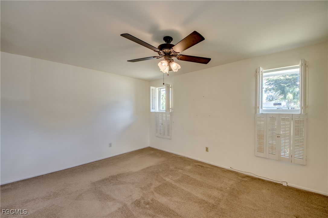 3728 Deleon Street Fort Myers, FL 33901 - Photo 40 of 50 an empty room with windows and fan