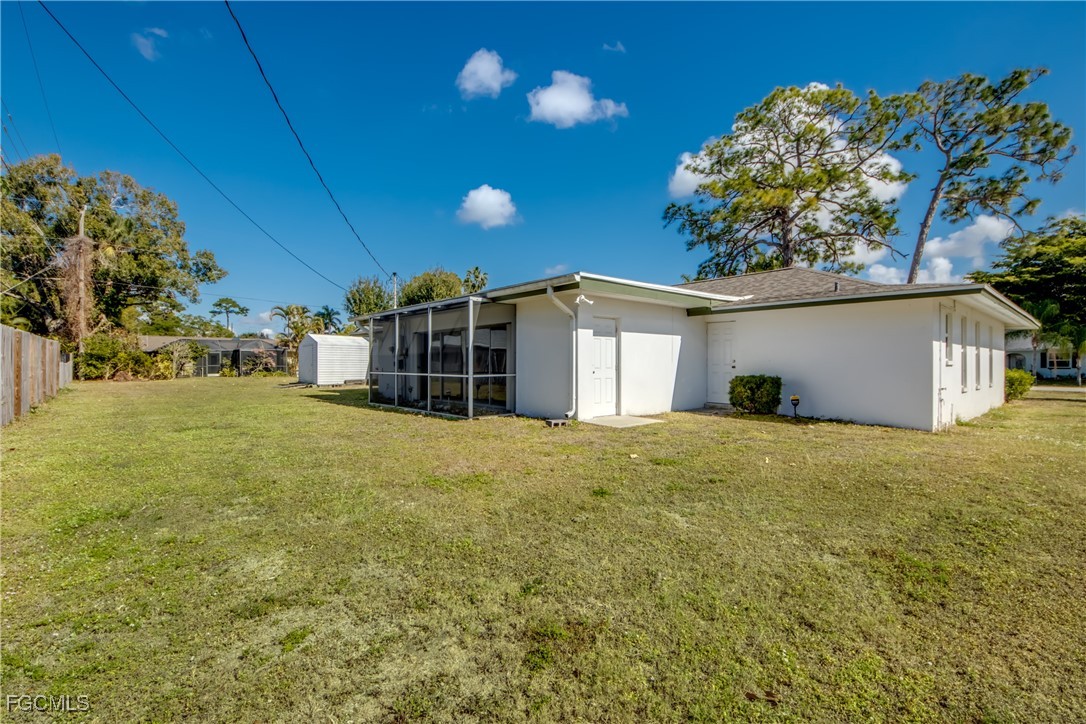 3728 Deleon Street Fort Myers, FL 33901 - Photo 48 of 50 a view of a house with a yard and garage