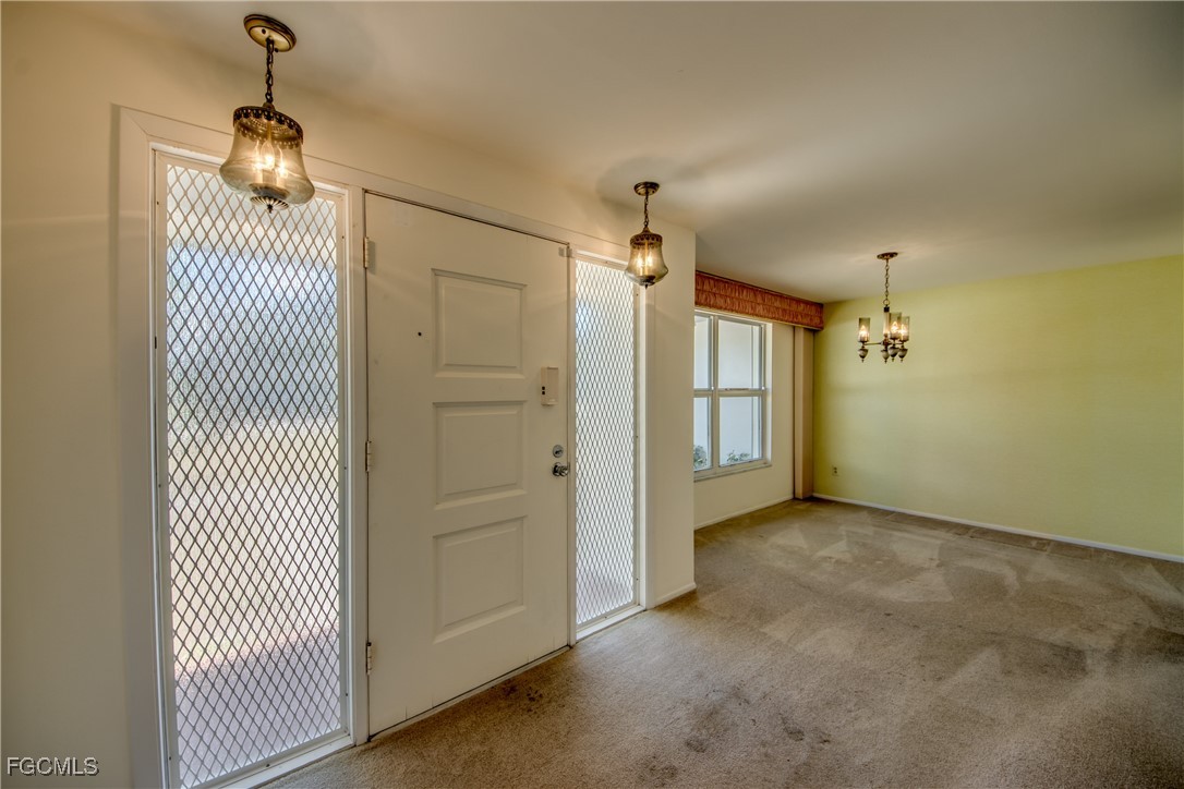 3728 Deleon Street Fort Myers, FL 33901 - Photo 6 of 50 an empty room with wooden floor and windows