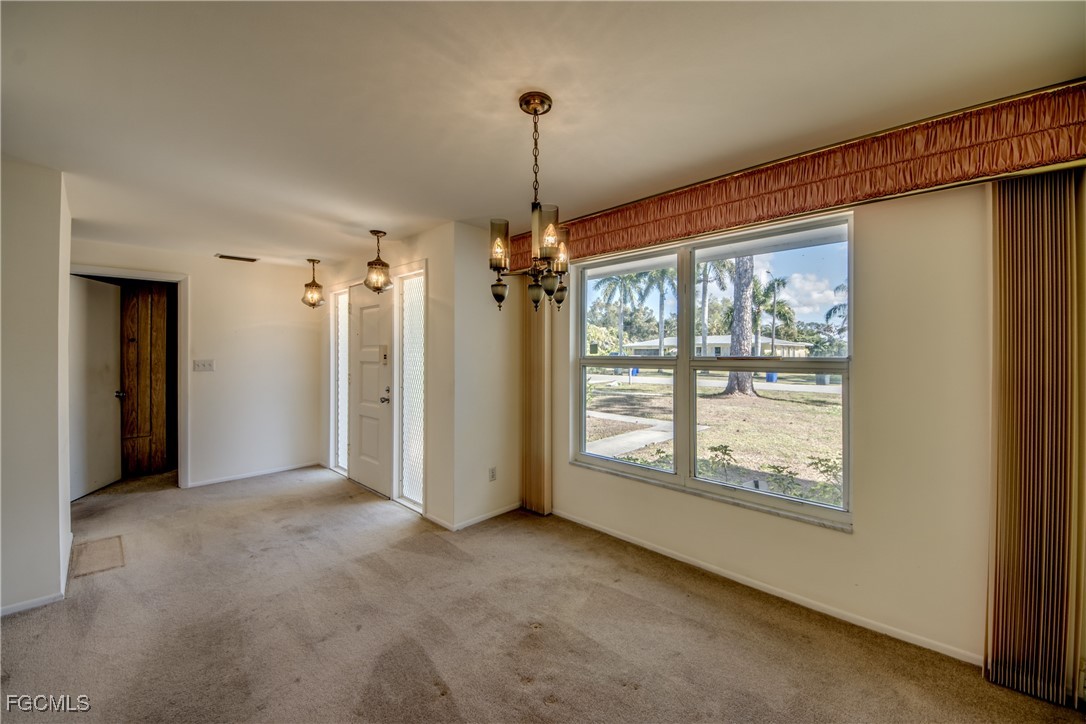 3728 Deleon Street Fort Myers, FL 33901 - Photo 10 of 50 a view of a room with windows and chandelier