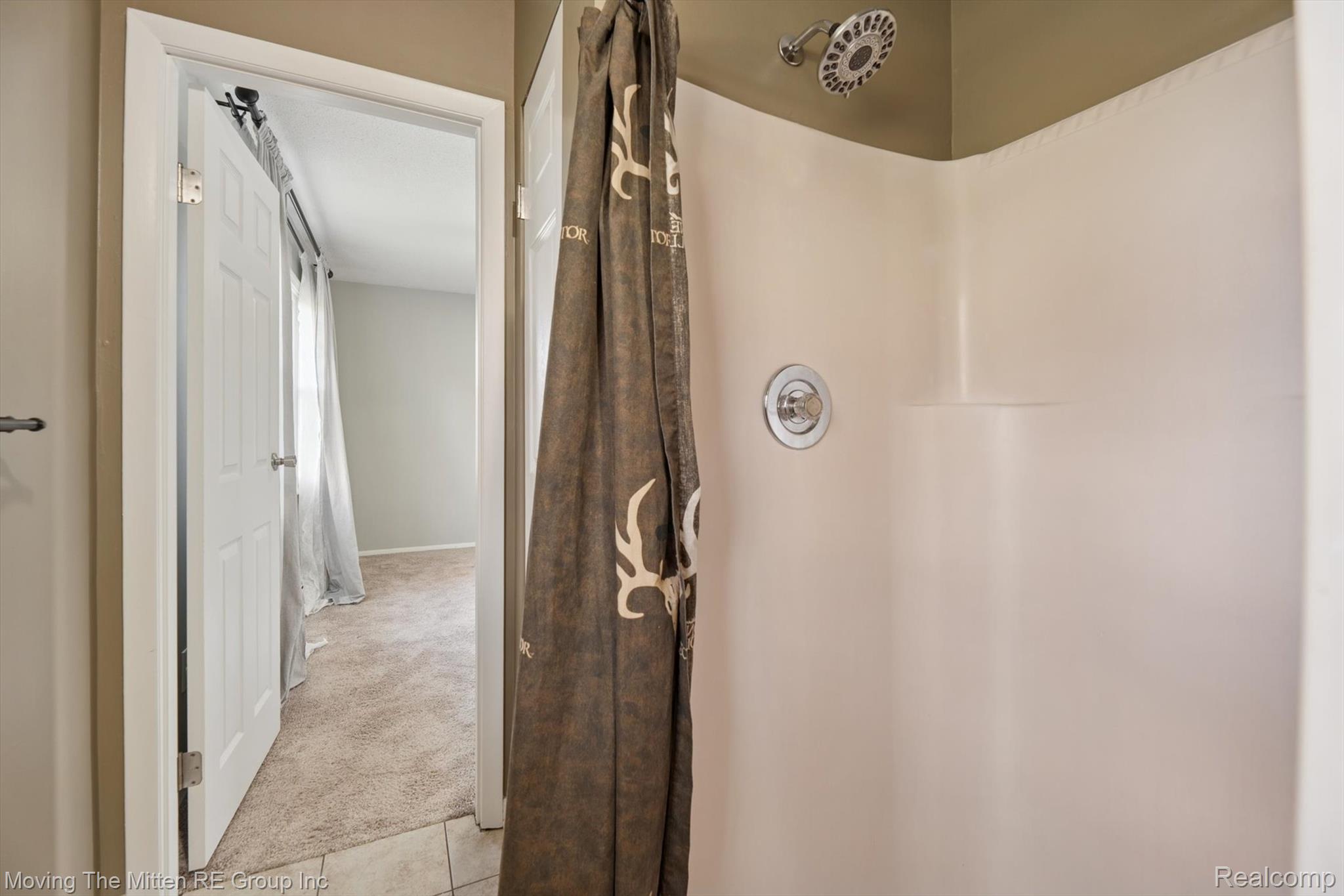 12000 Plank Road Milan, MI 48160 - Photo 19 of 49 Full bathroom featuring light carpet, a shower with curtain, and light tile patterned flooring