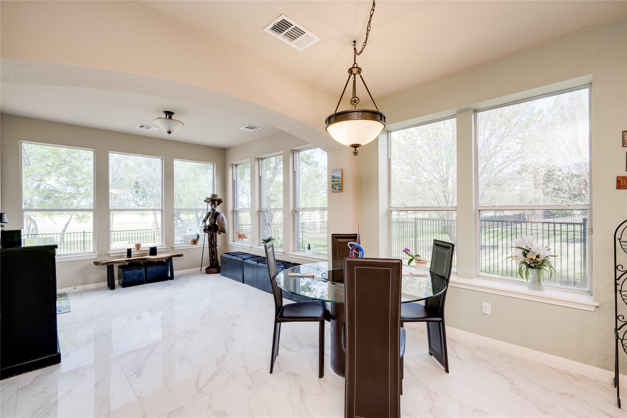 11332 Terrace Meadow Way Manor, TX 78653 - Photo 11 of 37 a view of a dining room with furniture large windows and wooden floor