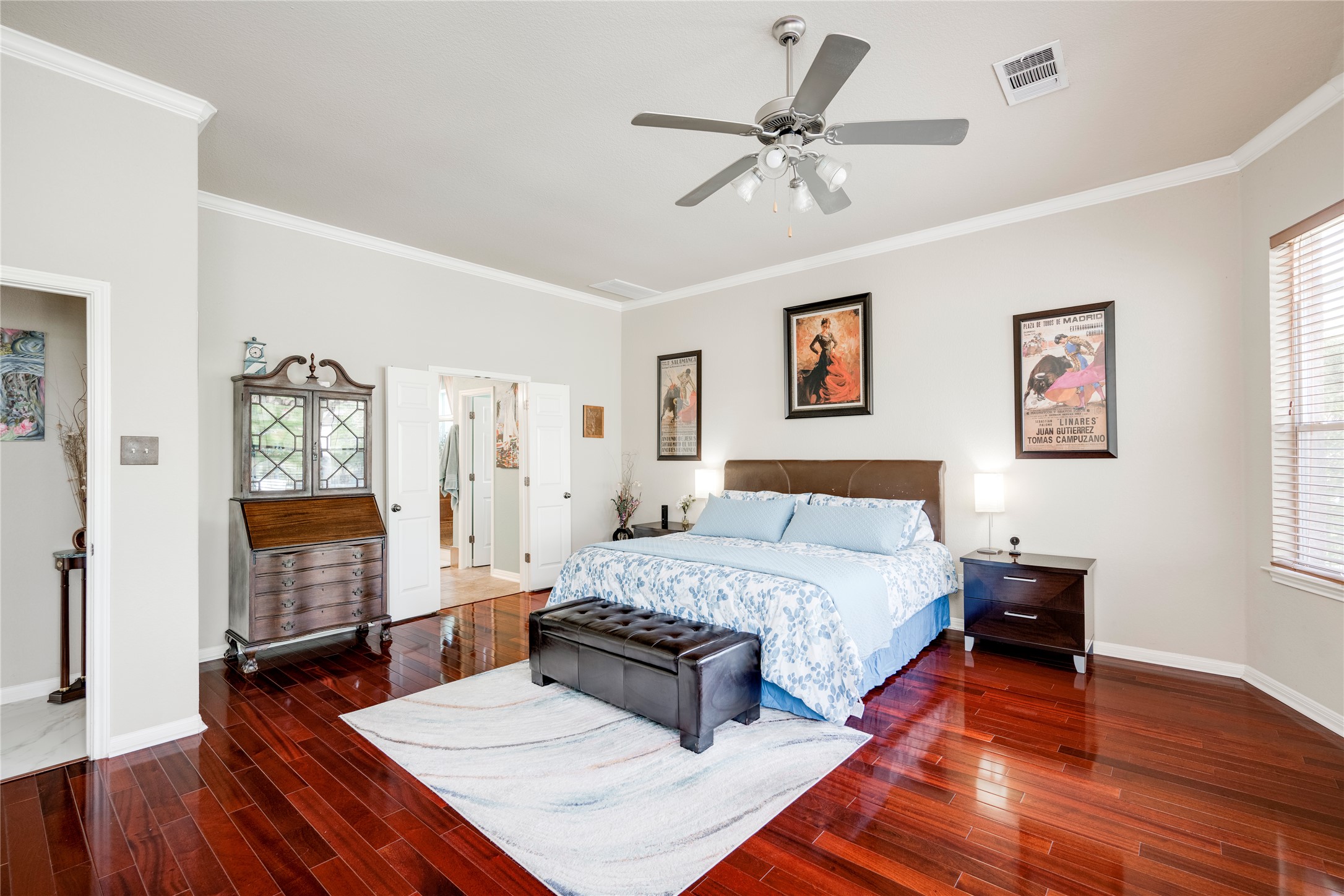 11332 Terrace Meadow Way Manor, TX 78653 - Photo 14 of 37 a bedroom with a bed and wooden floor