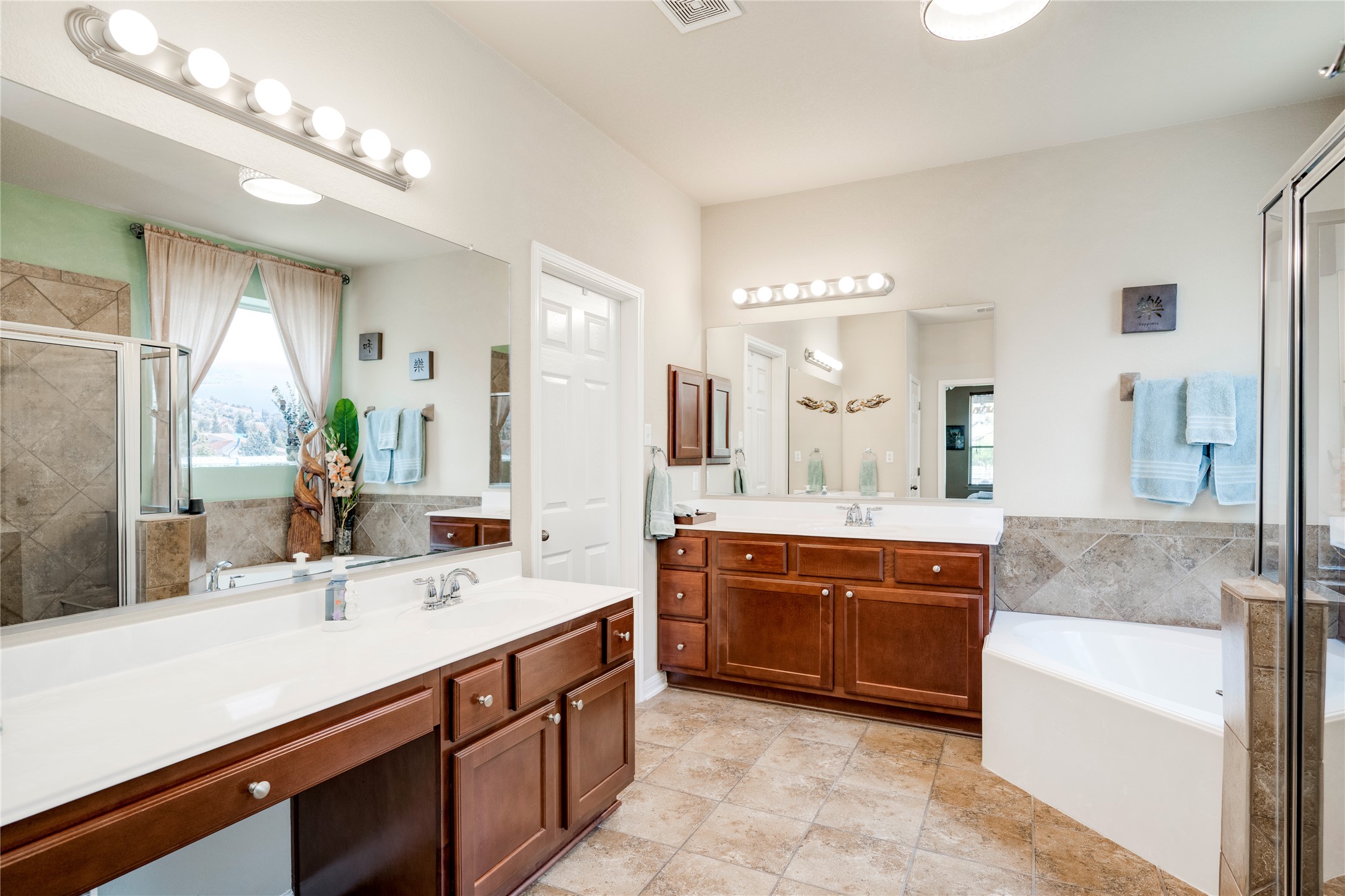 11332 Terrace Meadow Way Manor, TX 78653 - Photo 15 of 37 a bathroom with a sink double vanity granite tub shower and a mirror