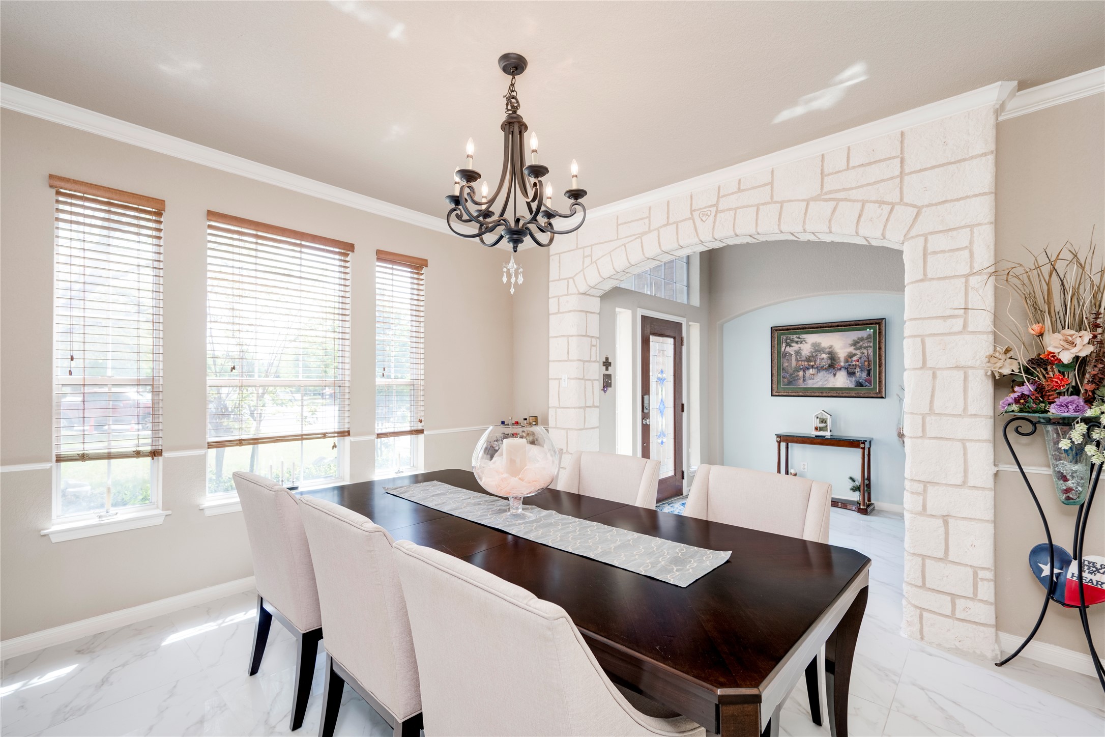 11332 Terrace Meadow Way Manor, TX 78653 - Photo 17 of 37 a dining room with furniture a chandelier and wooden floor