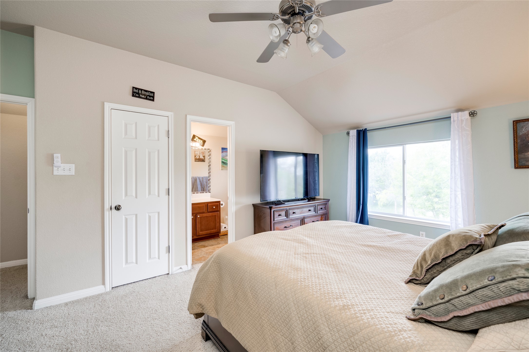 11332 Terrace Meadow Way Manor, TX 78653 - Photo 19 of 37 a bedroom with a bed and a chandelier