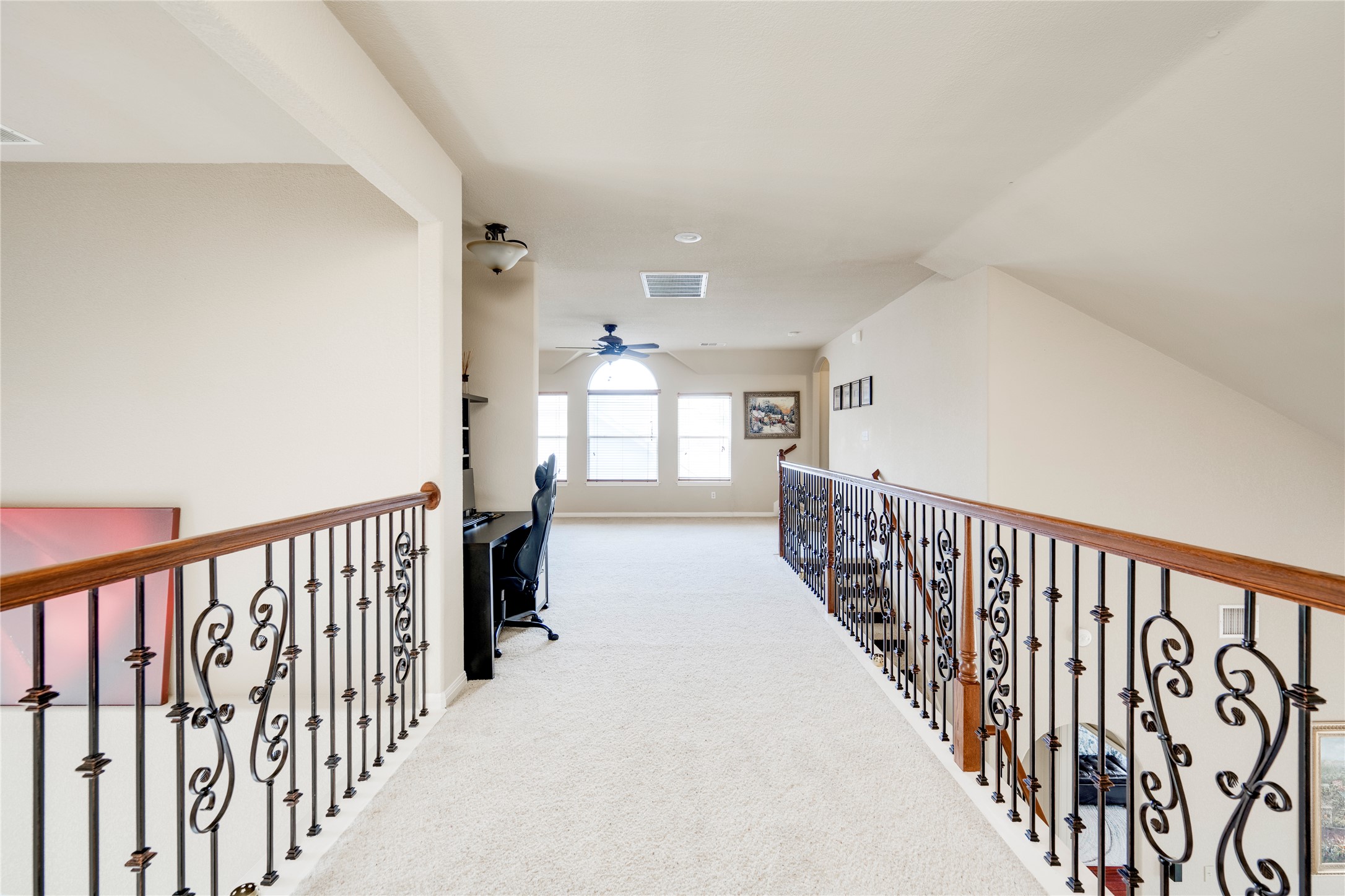 11332 Terrace Meadow Way Manor, TX 78653 - Photo 23 of 37 a view of a hallway with wooden floor and windows