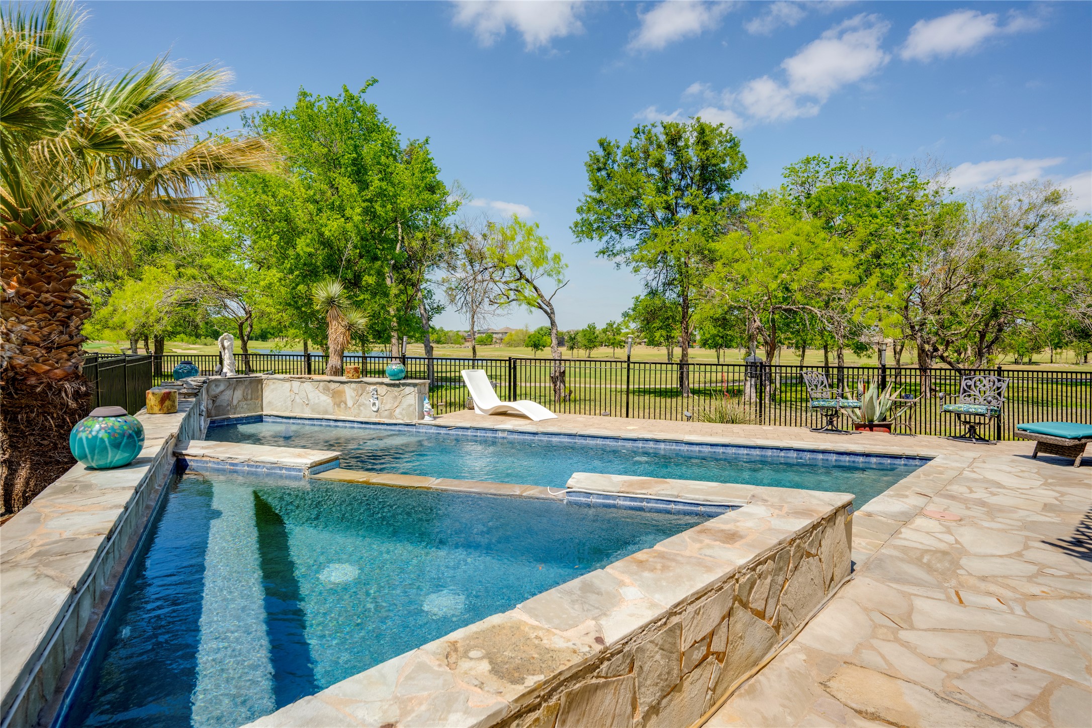 11332 Terrace Meadow Way Manor, TX 78653 - Photo 27 of 37 a view of a swimming pool with a lounge chair
