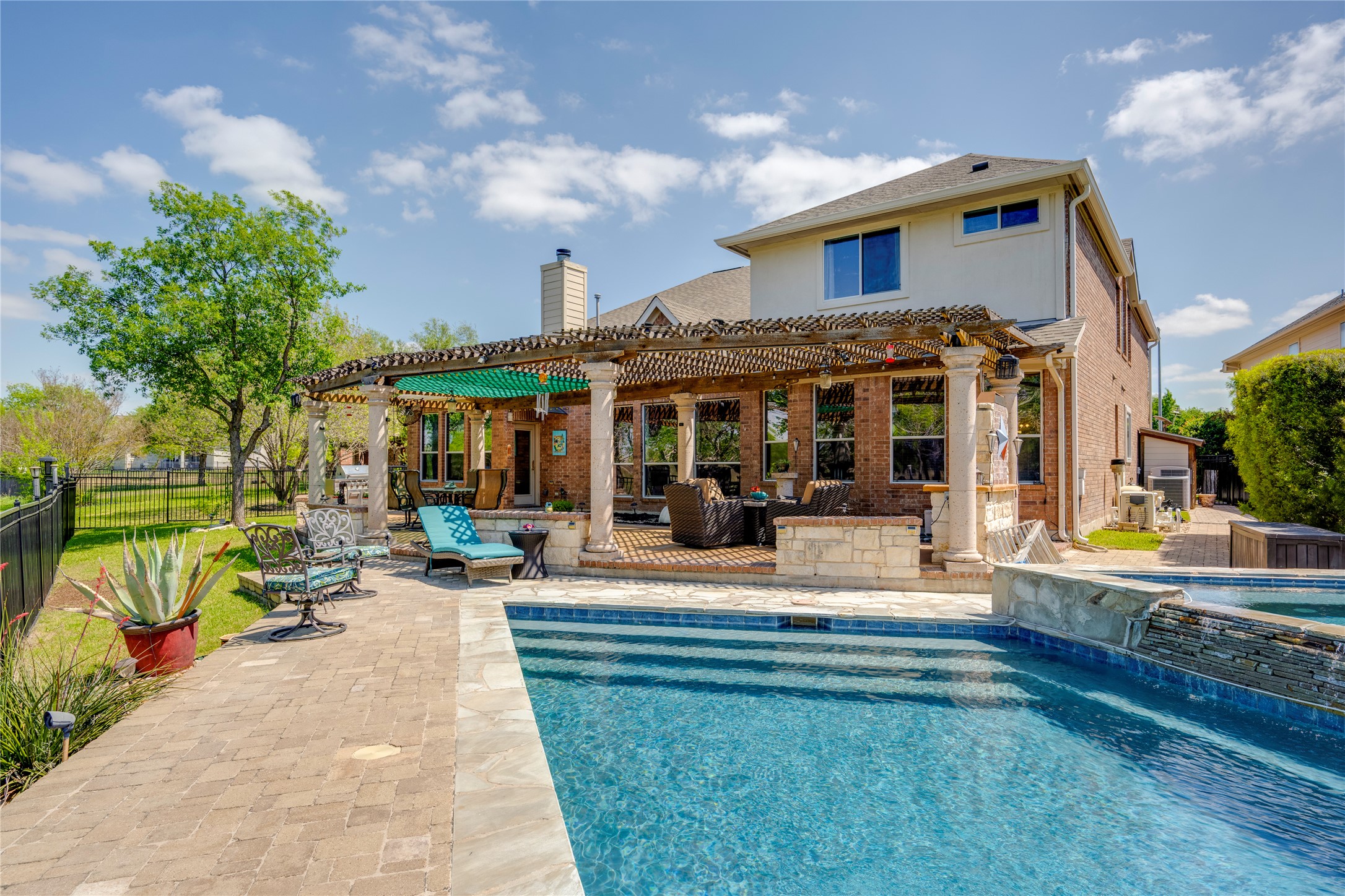 11332 Terrace Meadow Way Manor, TX 78653 - Photo 28 of 37 a view of a house with sitting area and garden