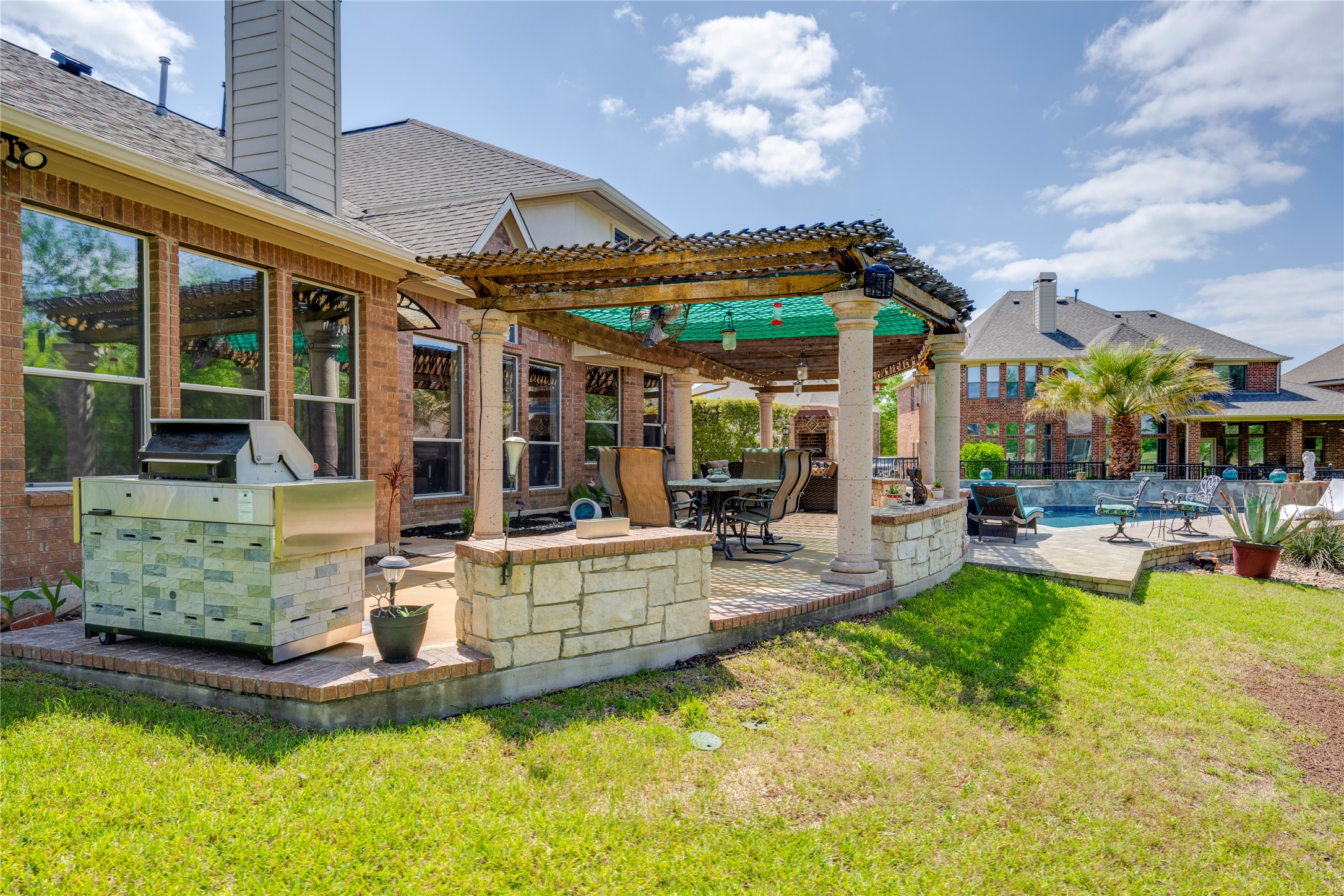 11332 Terrace Meadow Way Manor, TX 78653 - Photo 30 of 37 a view of a house with swimming pool and porch