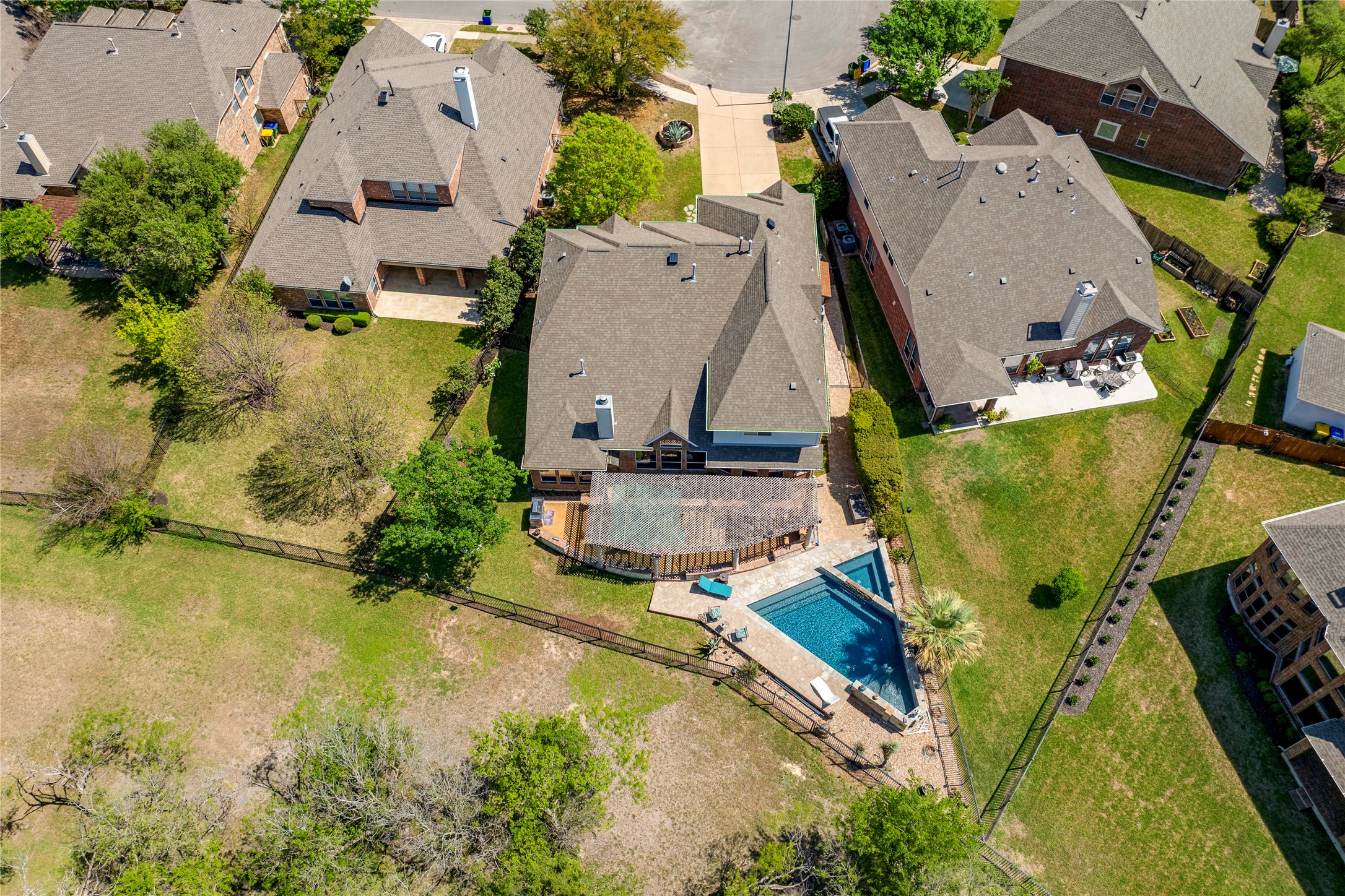11332 Terrace Meadow Way Manor, TX 78653 - Photo 35 of 37 an aerial view of a house with swimming pool and large trees