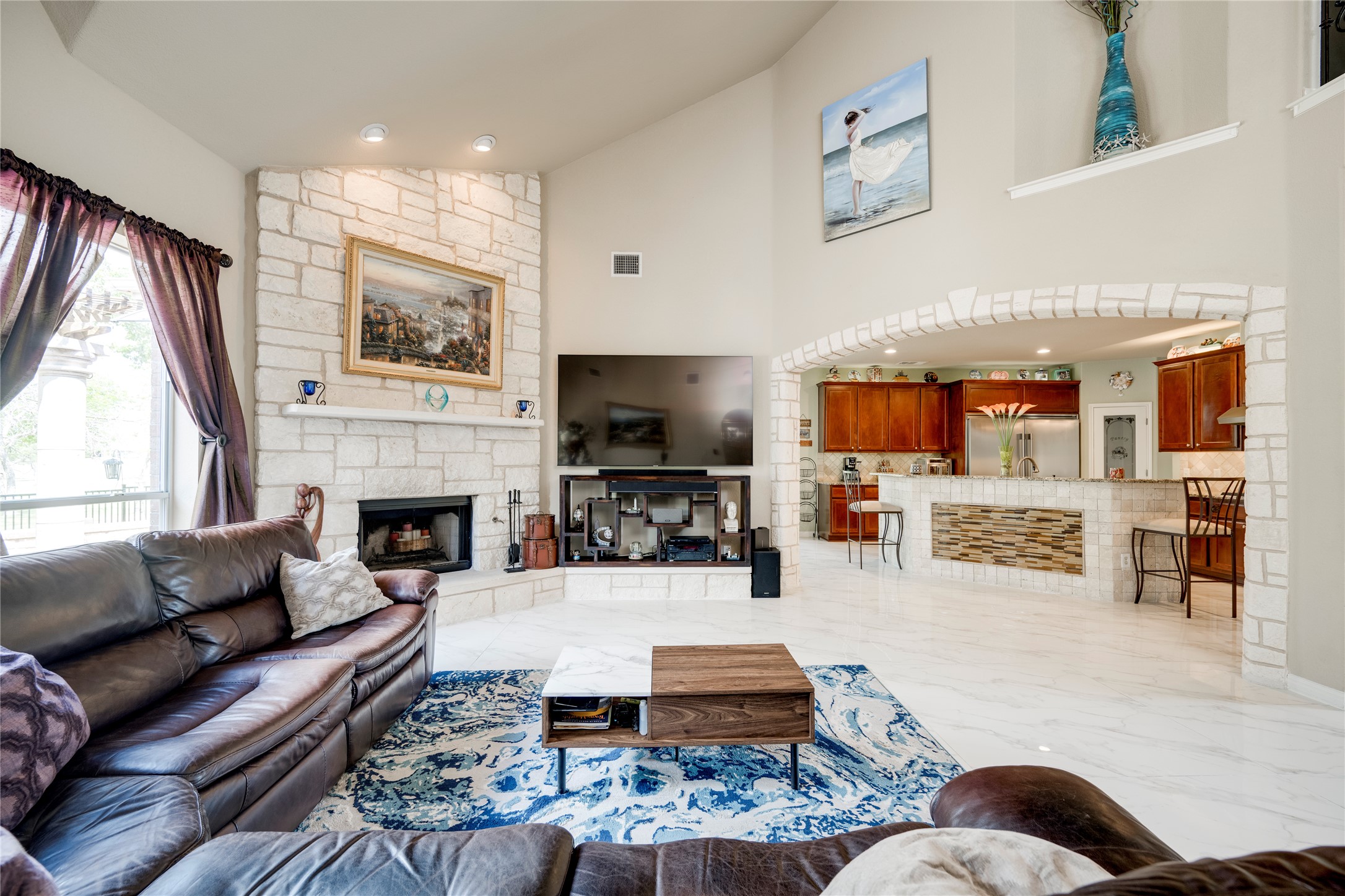 11332 Terrace Meadow Way Manor, TX 78653 - Photo 5 of 37 a living room with furniture a flat screen tv and a fireplace