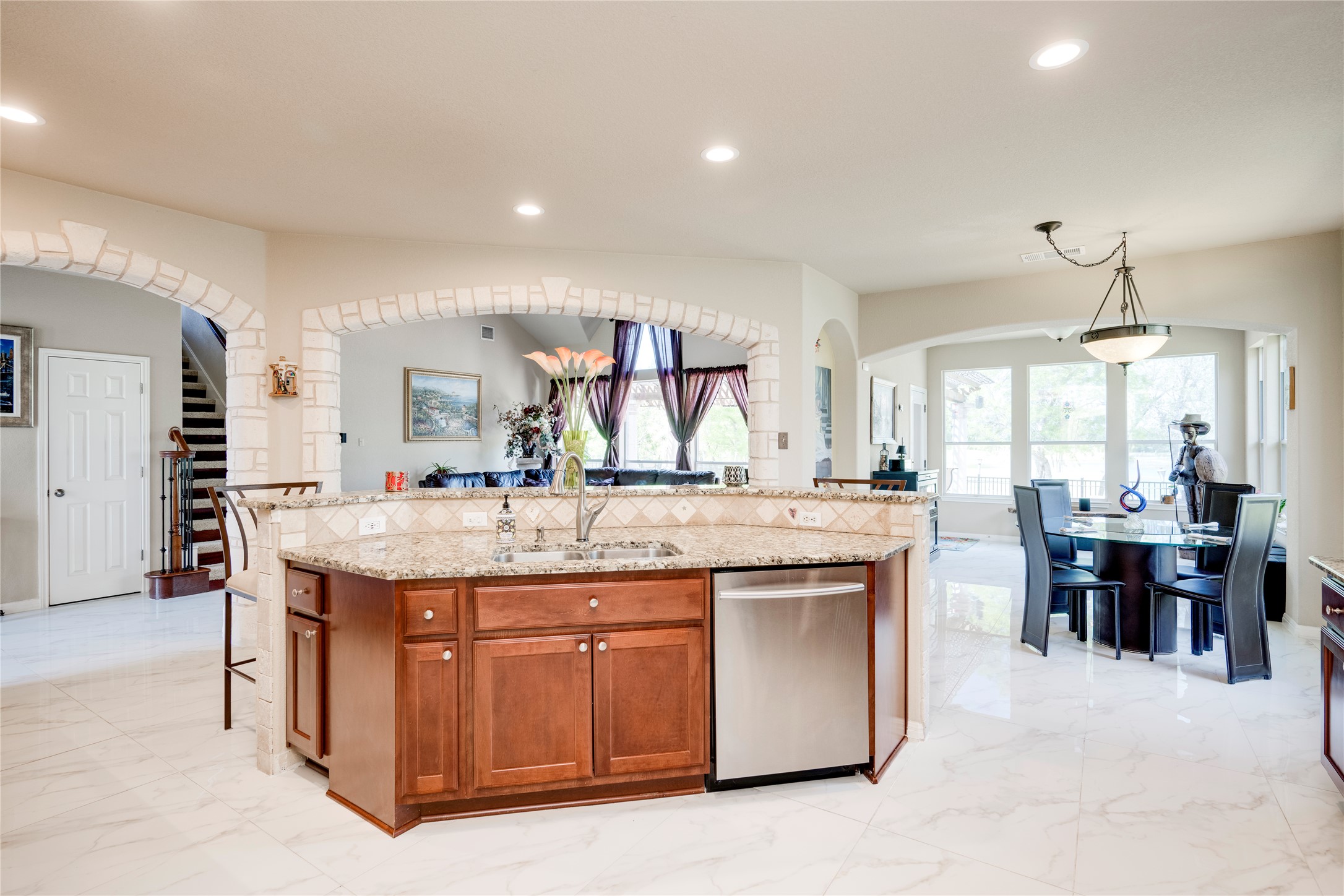 11332 Terrace Meadow Way Manor, TX 78653 - Photo 9 of 37 a kitchen with center island table and chairs