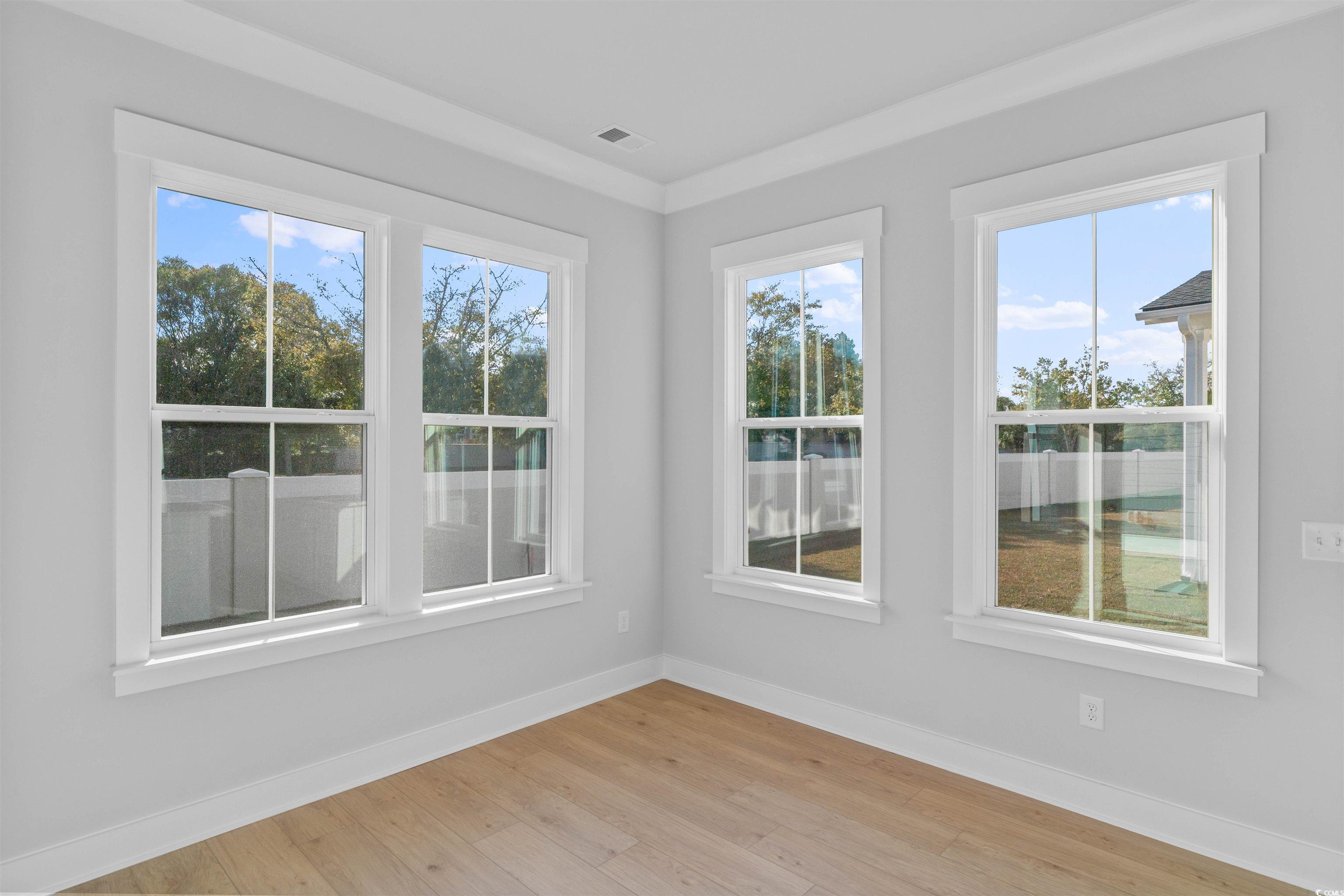 231 Atlantic Breeze Street Myrtle Beach, SC 29572 - Photo 10 of 21 Spare room featuring healthy amount of natural light and light wood finished floors