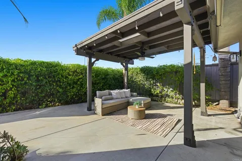 a view of patio with a table chairs and a potted plant
