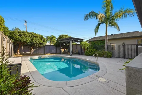a view of a swimming pool with a patio