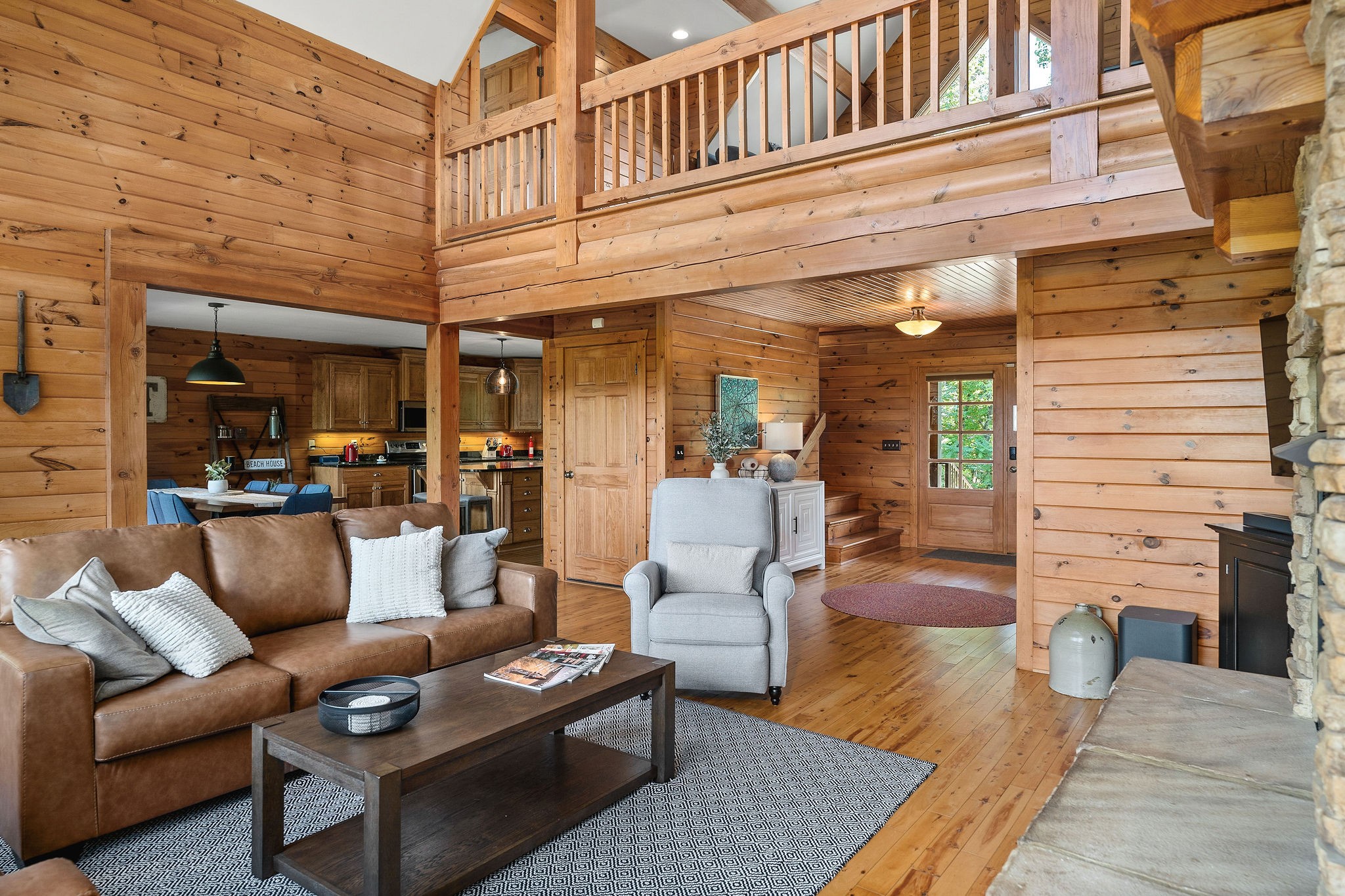 4415 Coconut Ridge Road Smithville, TN 37166 - Photo 11 of 52 a view of a patio with couches and a dining table and chairs with wooden floor