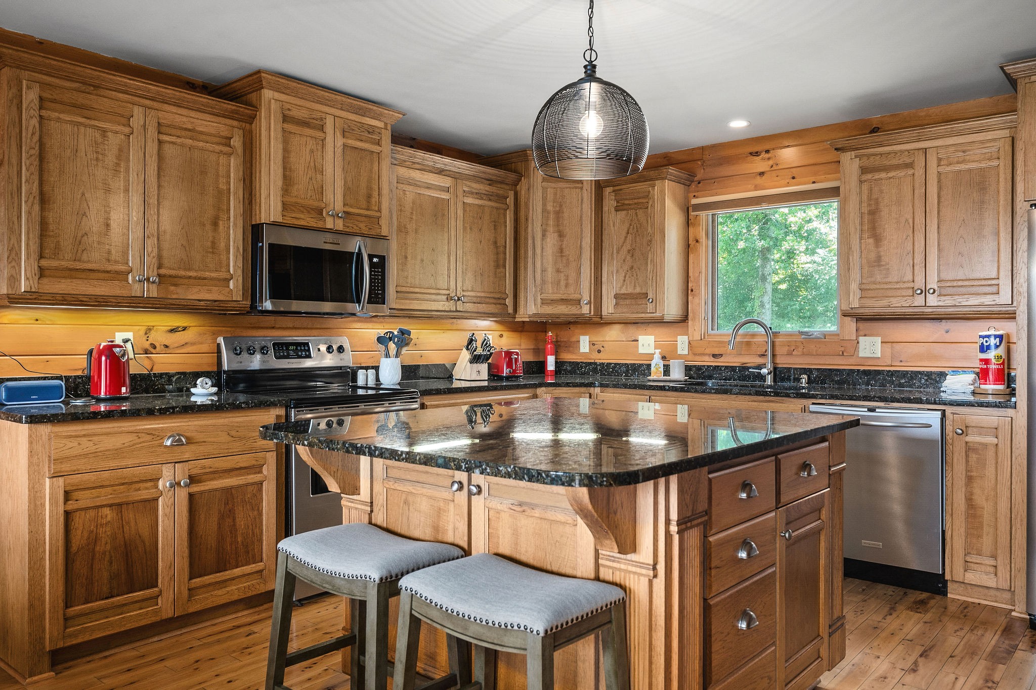 4415 Coconut Ridge Road Smithville, TN 37166 - Photo 16 of 52 a kitchen with granite countertop a sink counter top space appliances and cabinets