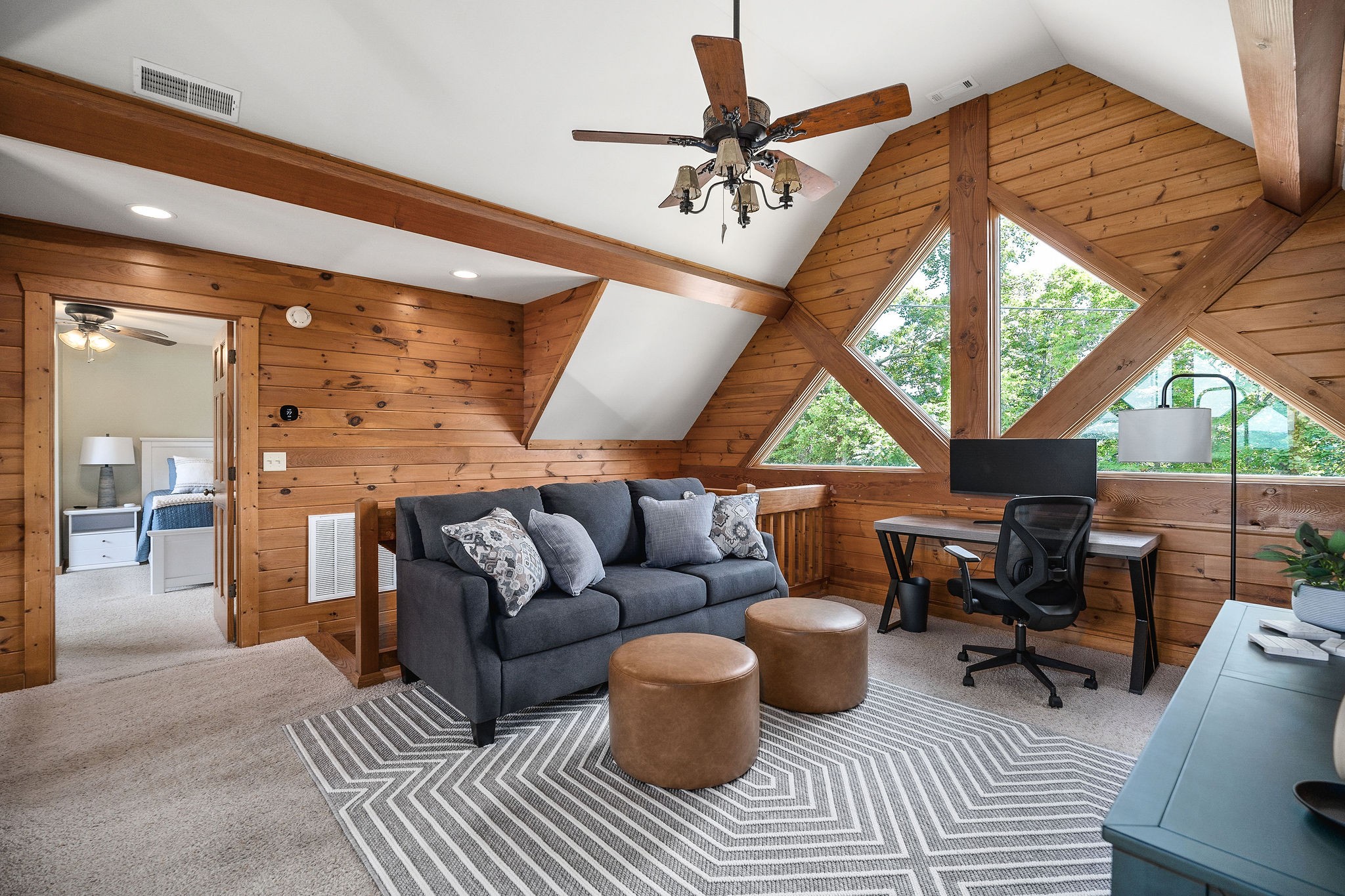 4415 Coconut Ridge Road Smithville, TN 37166 - Photo 30 of 52 a living room with furniture a fireplace and a floor to ceiling window
