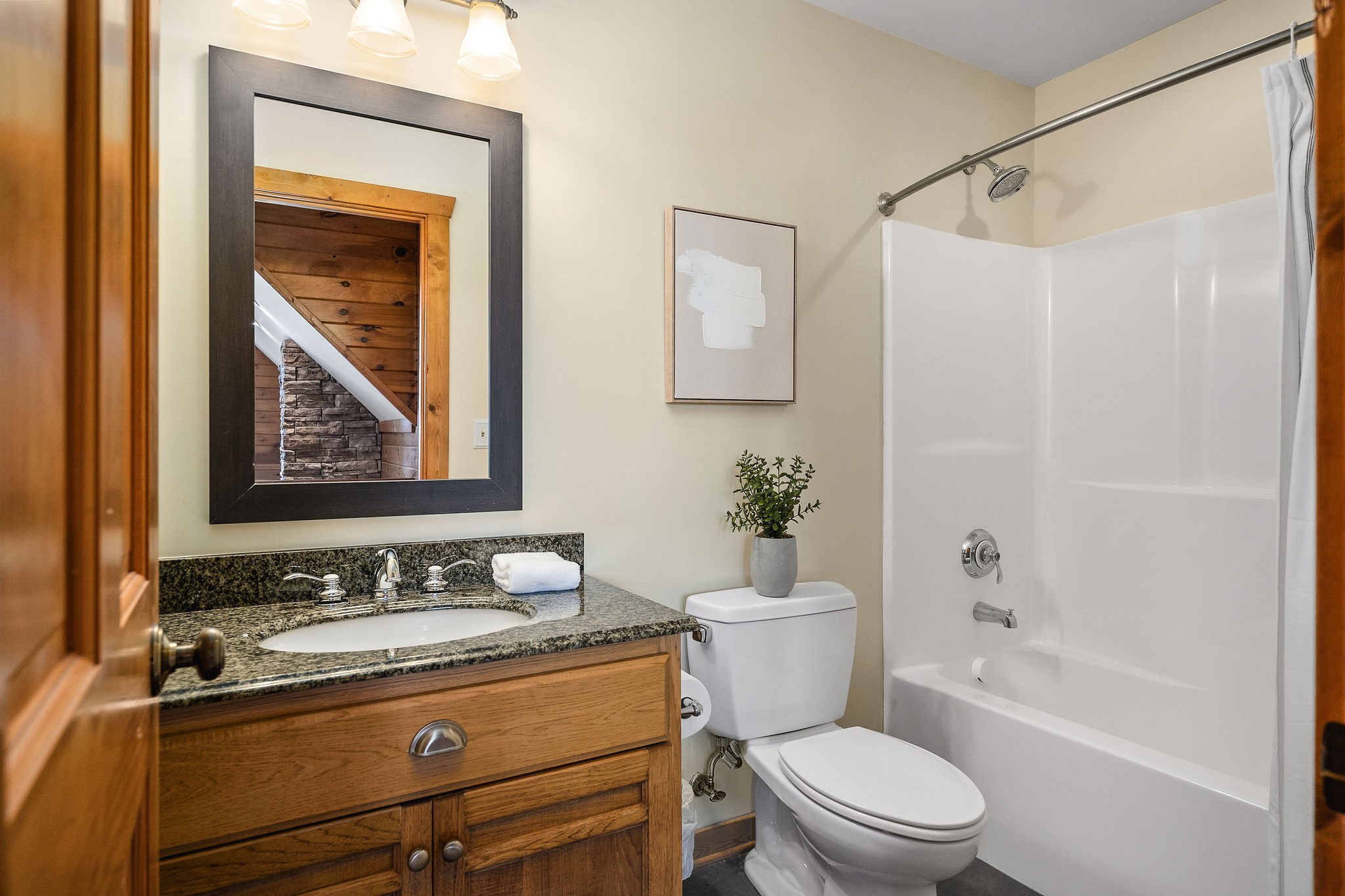 4415 Coconut Ridge Road Smithville, TN 37166 - Photo 38 of 52 a bathroom with a granite countertop toilet a sink and a bathtub