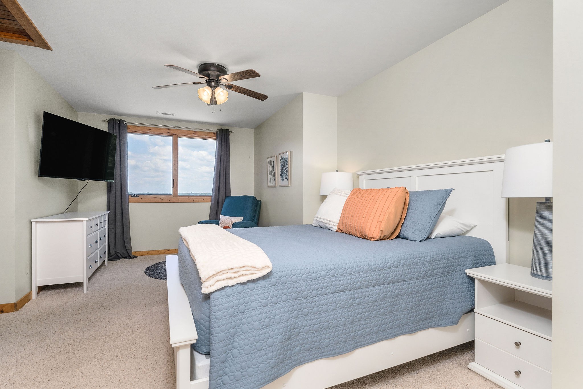 4415 Coconut Ridge Road Smithville, TN 37166 - Photo 40 of 52 a bedroom with a large bed and a flat screen tv