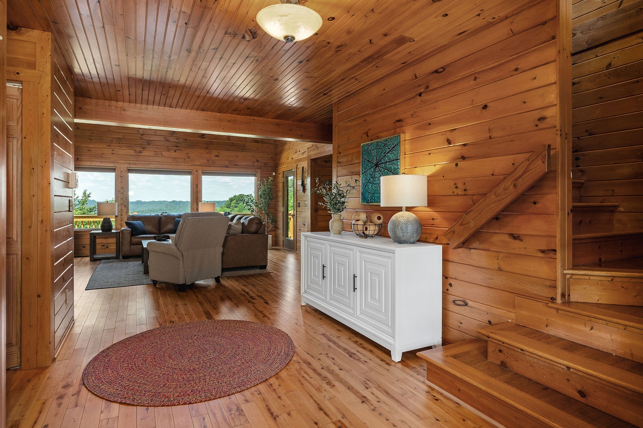 4415 Coconut Ridge Road Smithville, TN 37166 - Photo 5 of 52 a room with wooden floors stairs and furniture