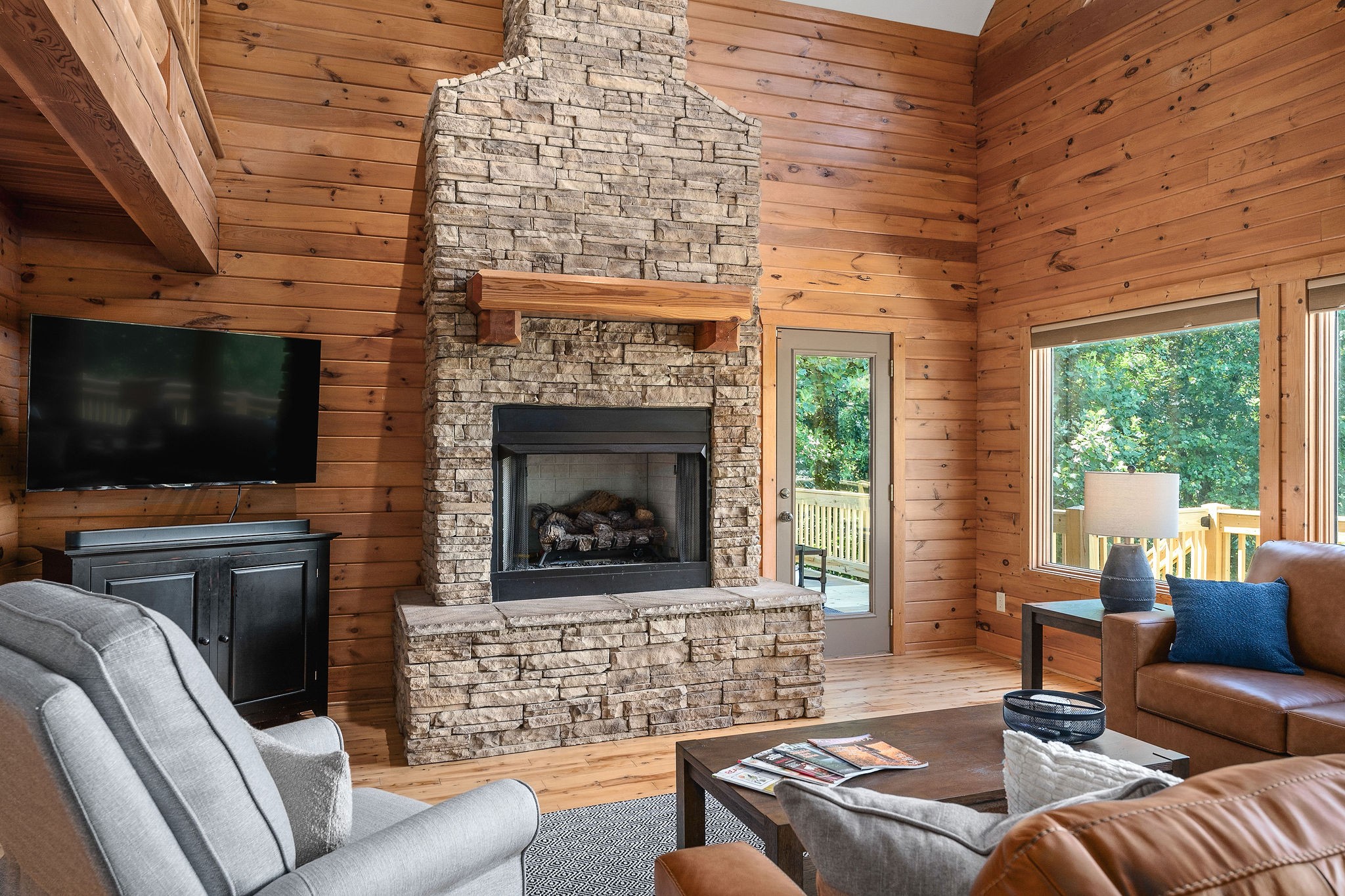 4415 Coconut Ridge Road Smithville, TN 37166 - Photo 9 of 52 a living room with furniture a flat screen tv and a fireplace