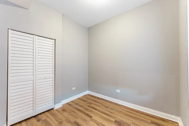 a view of a small space with wooden floor