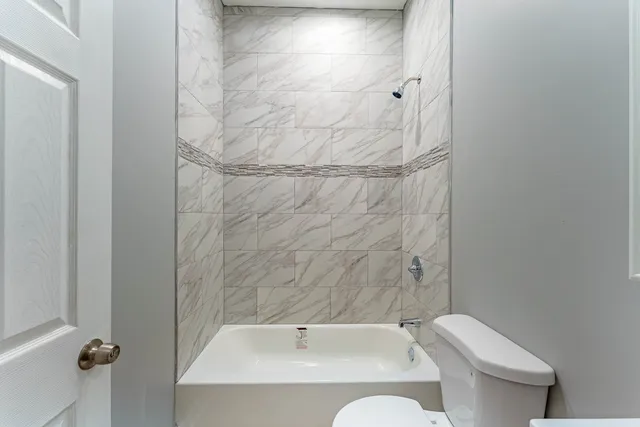 a bathroom with a toilet and sink