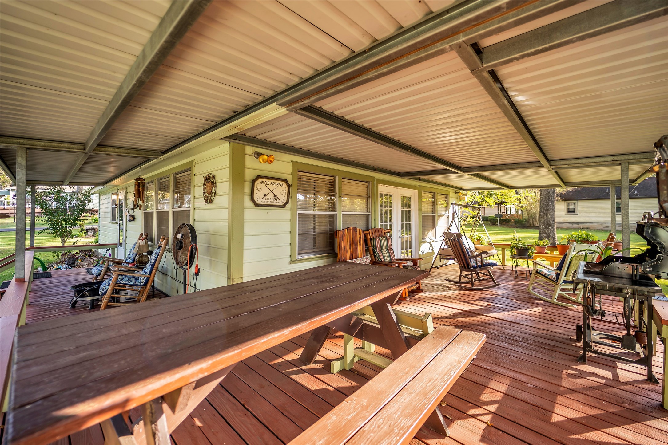 590 Cove Loop Coldspring, TX 77331 - Photo 13 of 36 a view of a patio with table and chairs under an umbrella