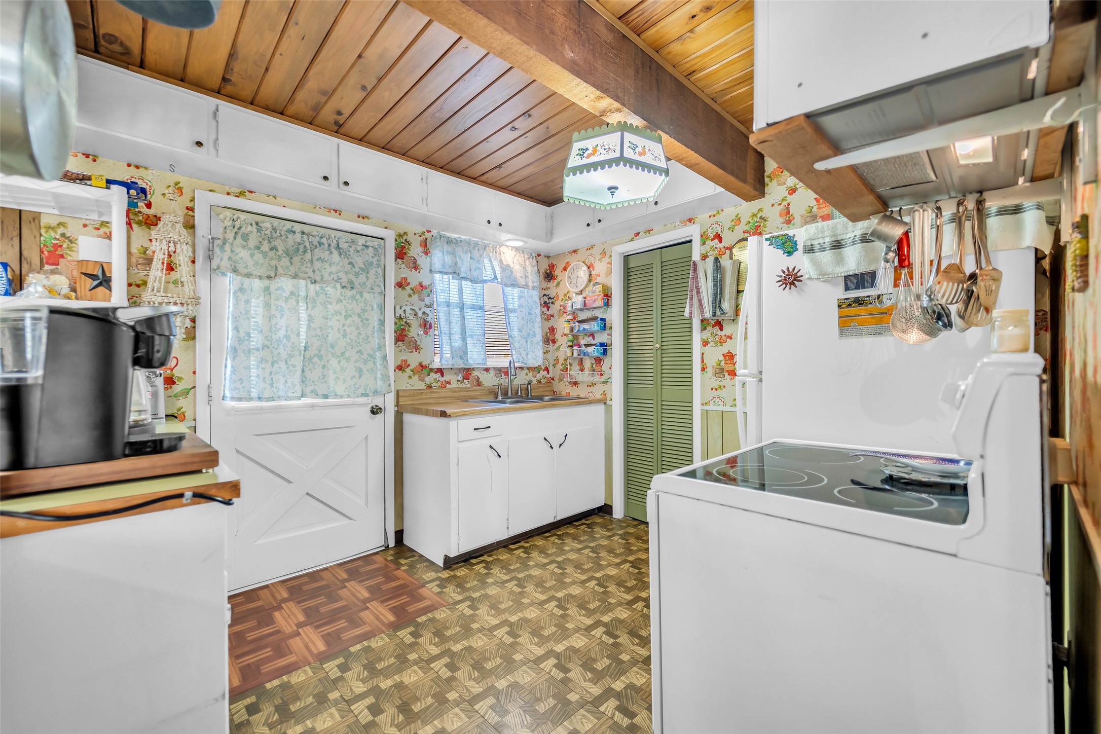 590 Cove Loop Coldspring, TX 77331 - Photo 18 of 36 Charming wood plank ceiling in kitchen adds a nice rustic cabin touch.