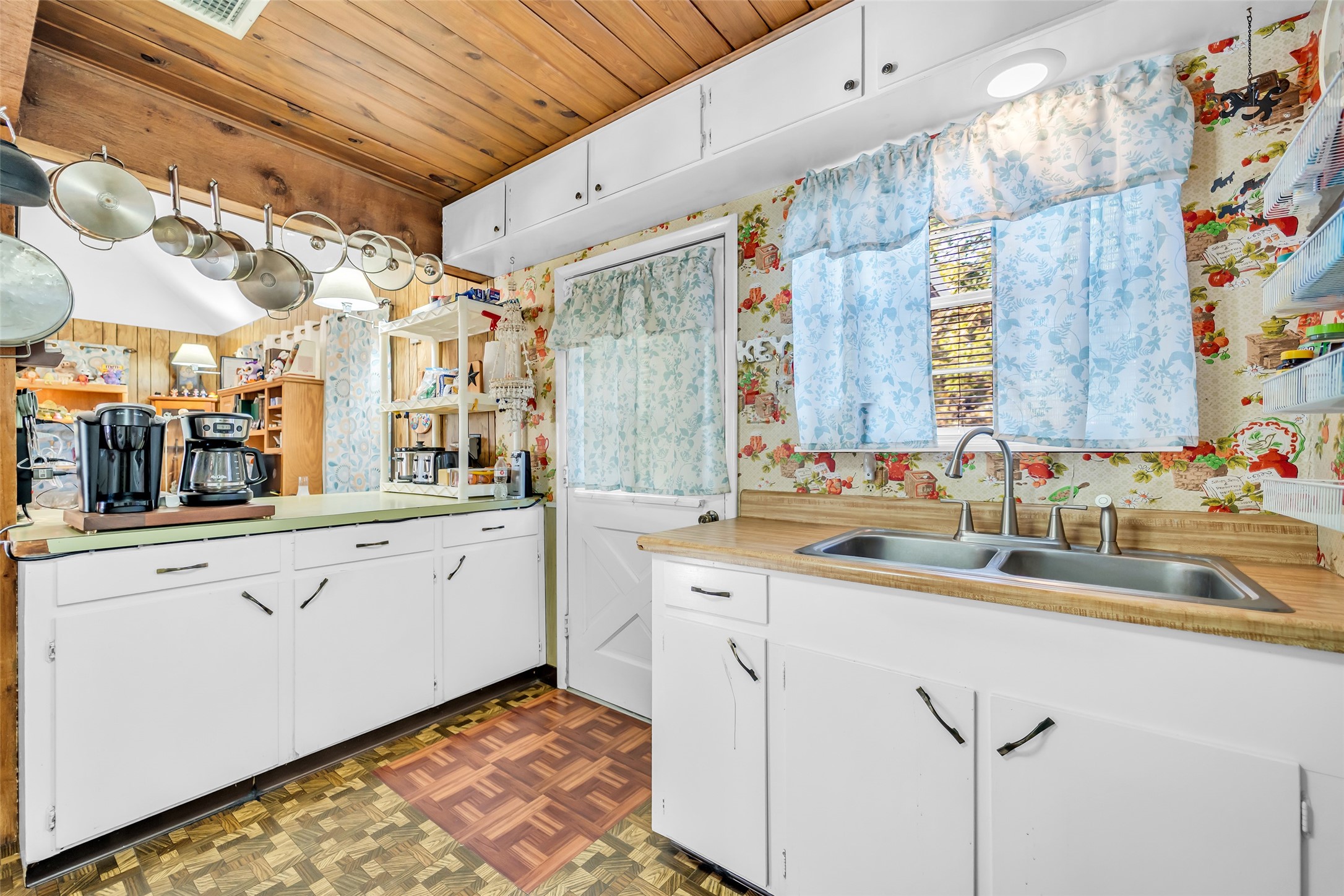 590 Cove Loop Coldspring, TX 77331 - Photo 19 of 36 a large white kitchen with a sink and cabinets