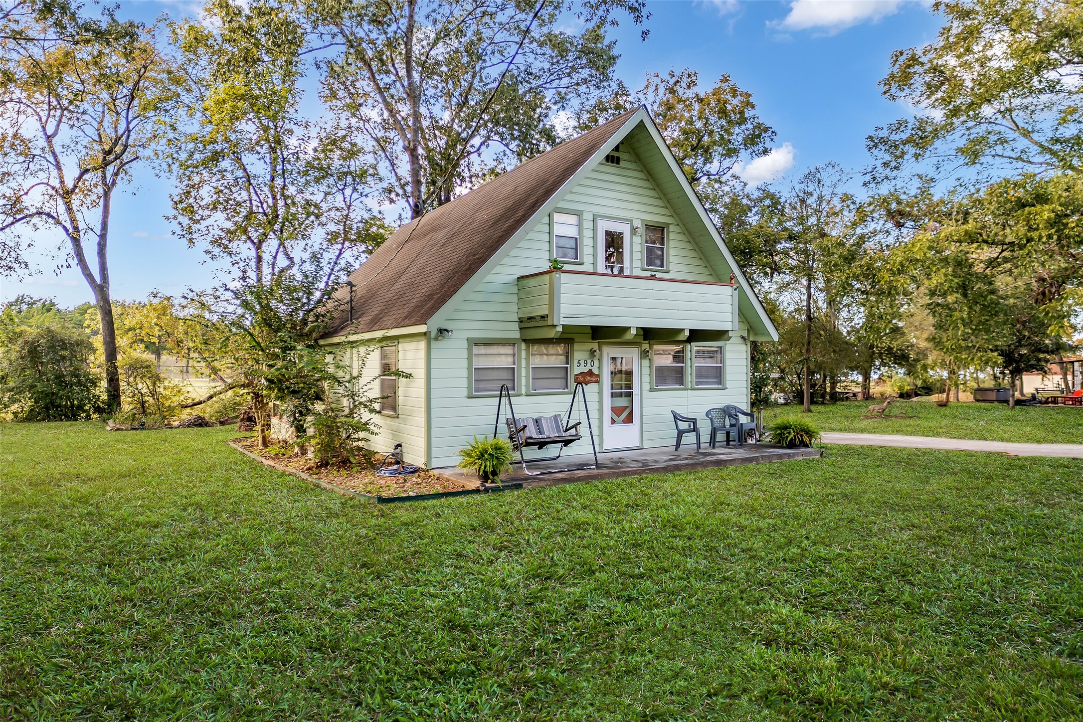 590 Cove Loop Coldspring, TX 77331 - Photo 2 of 36 front view of a house with a yard