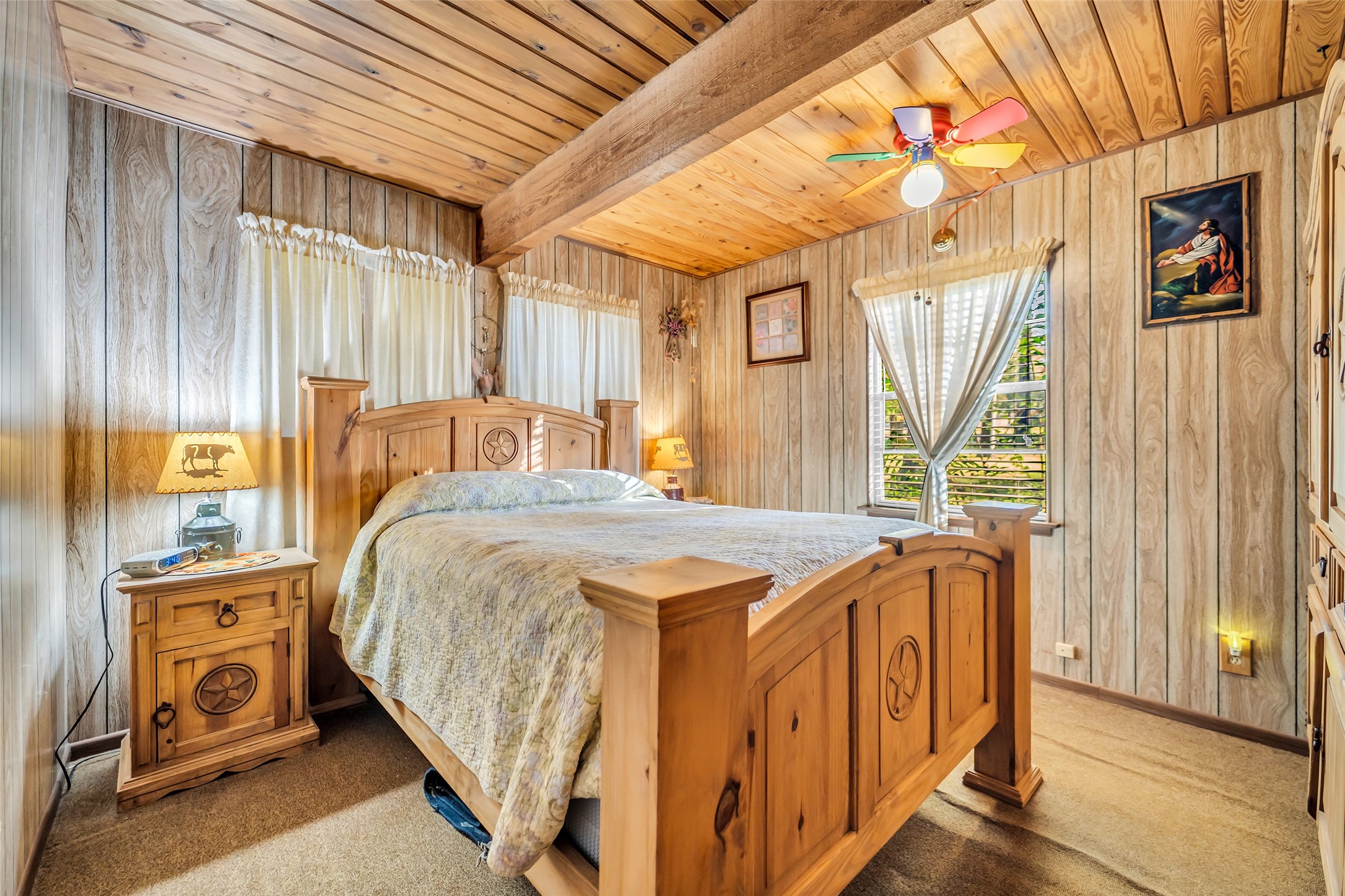 590 Cove Loop Coldspring, TX 77331 - Photo 27 of 36 a bedroom with a bed and a mirror