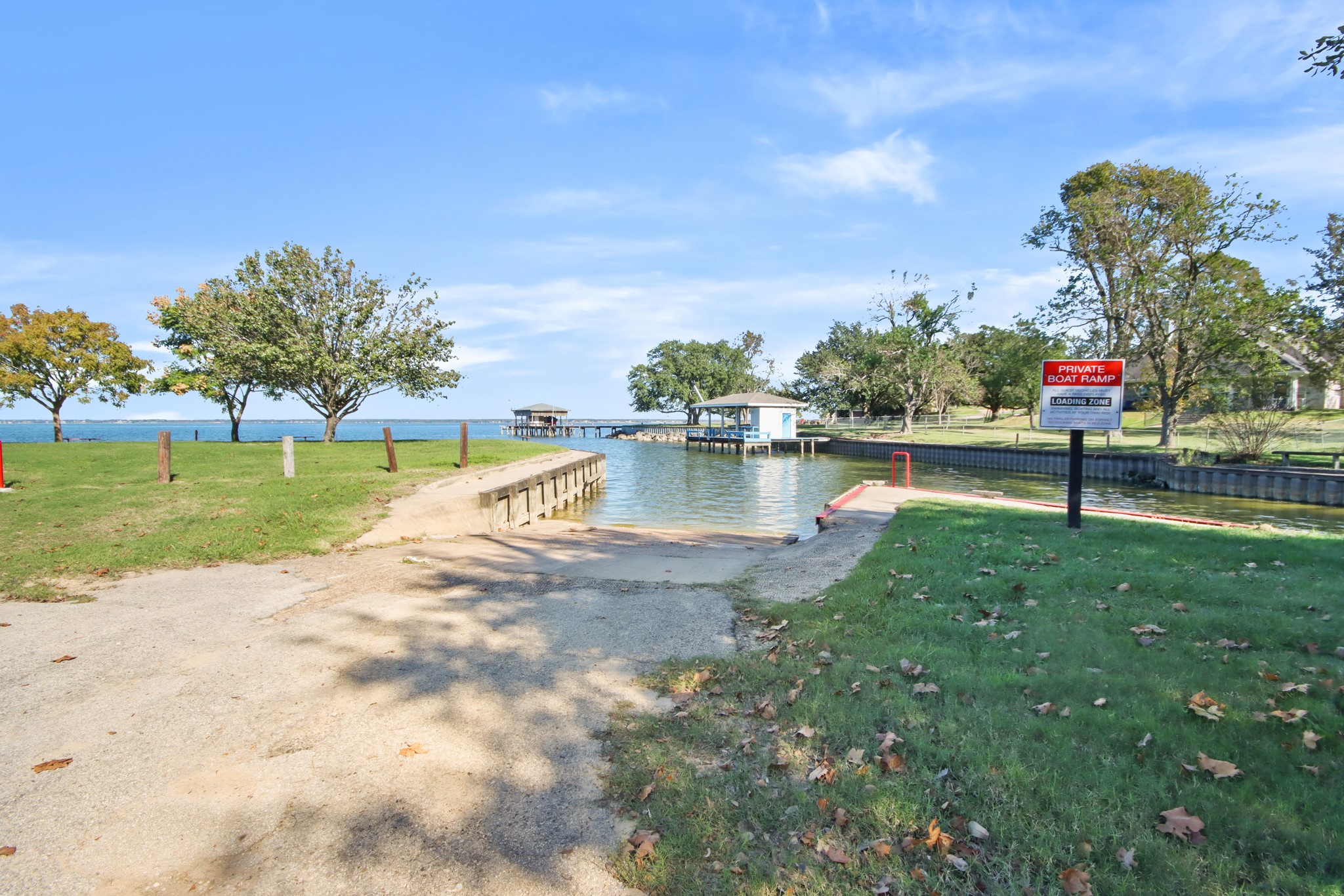 590 Cove Loop Coldspring, TX 77331 - Photo 35 of 36 a view of a lake with a house