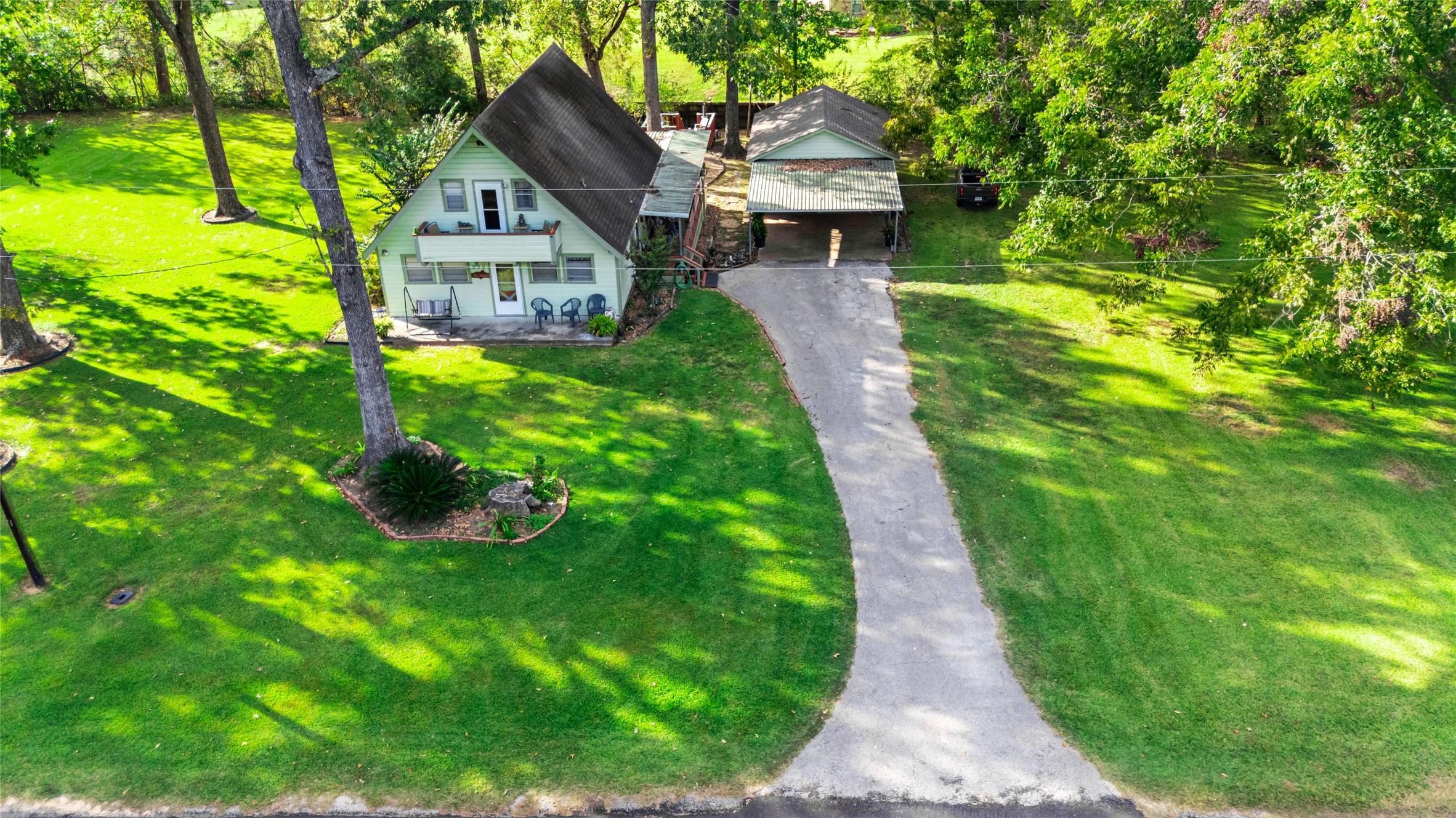 590 Cove Loop Coldspring, TX 77331 - Photo 5 of 36 a front view of a house with garden