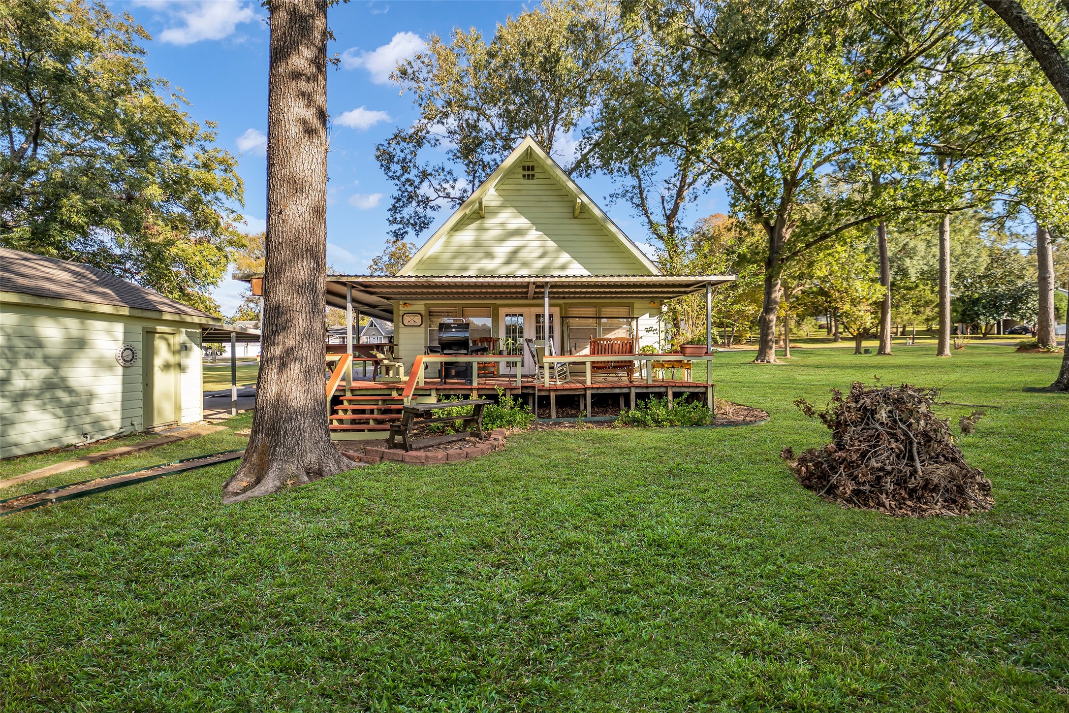 590 Cove Loop Coldspring, TX 77331 - Photo 10 of 36 a view of a house with a big yard and sitting area