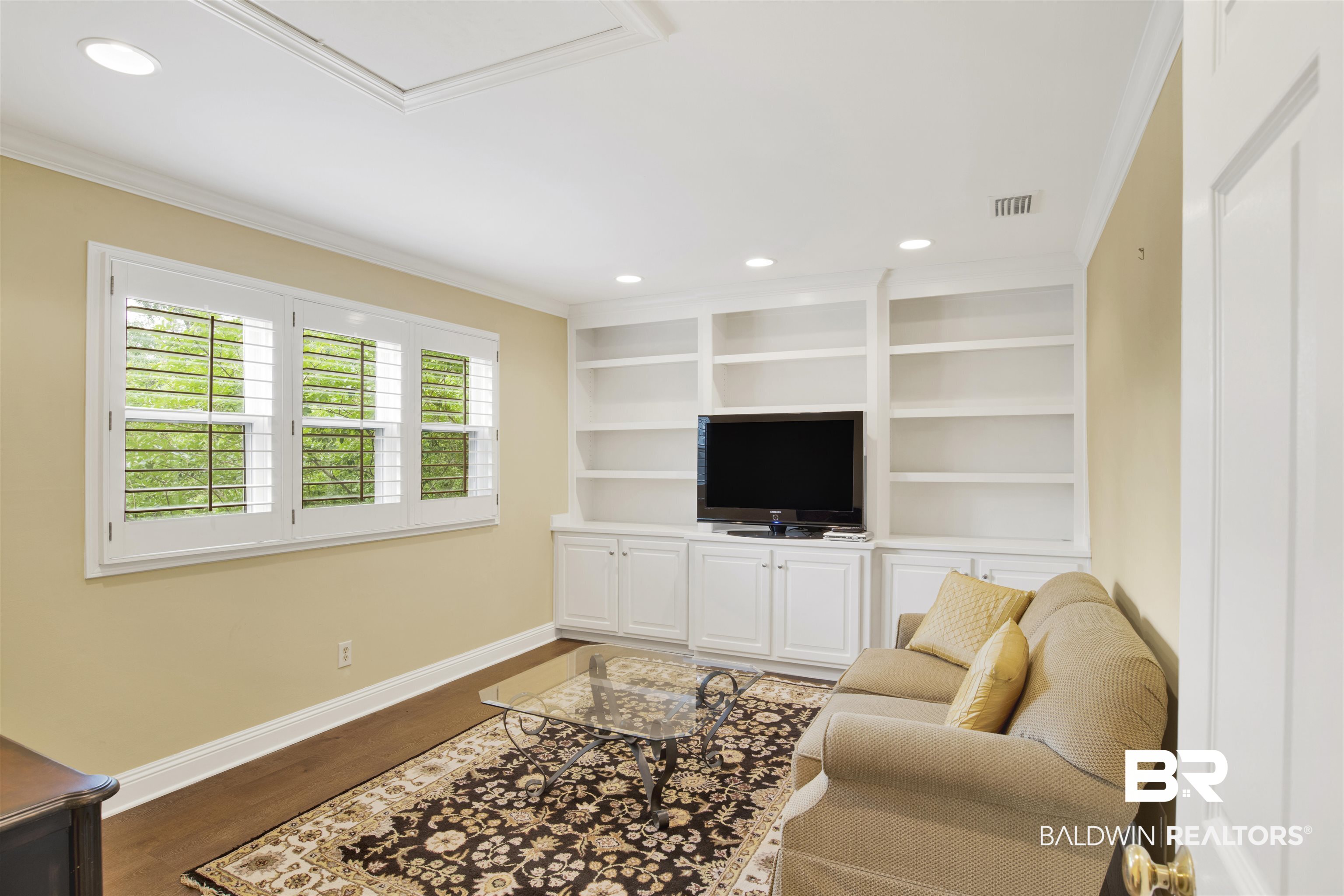 16864 Ferry Rd Circle Fairhope, AL 36532 - Photo 32 of 68 Living area featuring crown molding, baseboards, dark wood finished floors, and recessed lighting