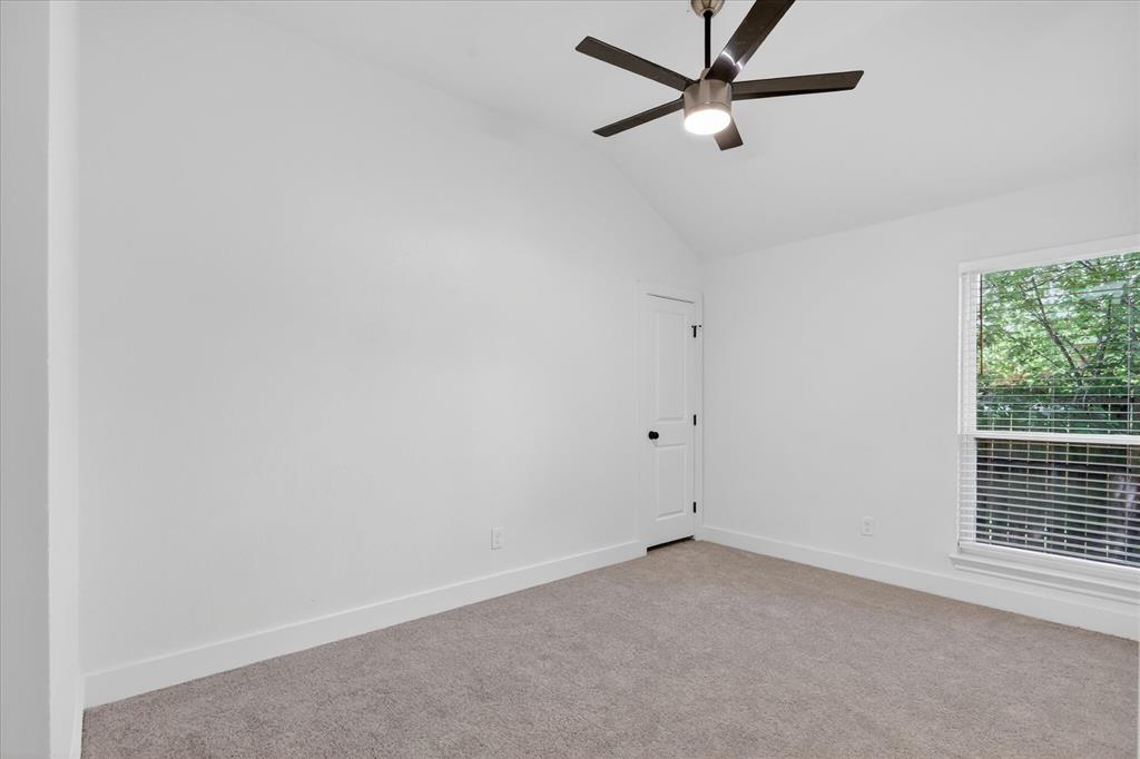 6021 Hartman Road Forest Hill, TX 76119 - Photo 19 of 27 an empty room with a window and a fan