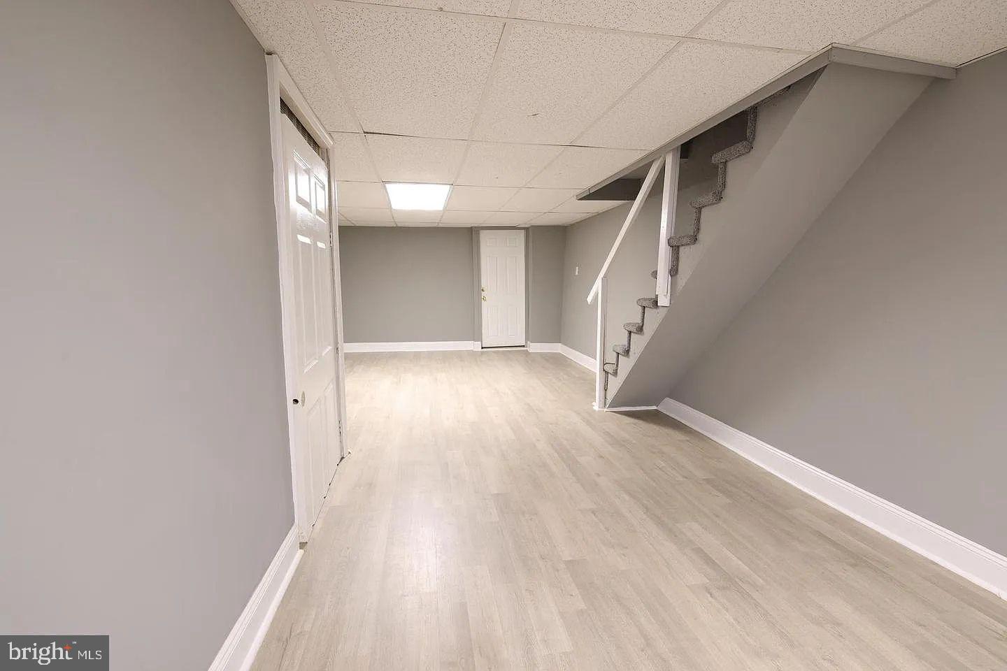83 North State Road Upper Darby, PA 19082 - Photo 16 of 27 a view of hallway with stairs and wooden floor