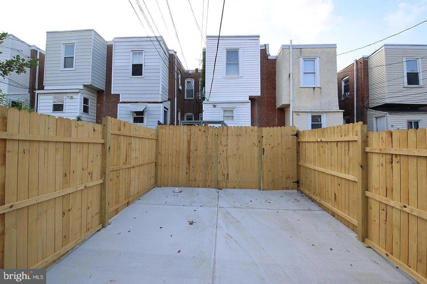 83 North State Road Upper Darby, PA 19082 - Photo 8 of 27 a view of a blue buildings with wooden fence