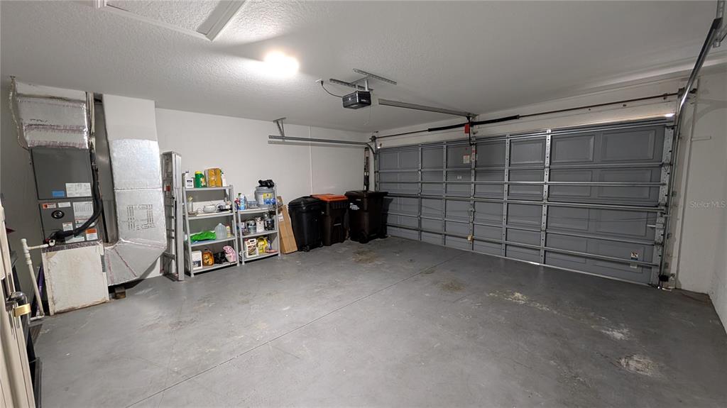 10912 Southwest 69th Circle Ocala, FL 34476 - Photo 10 of 11 a view of a garage with storage