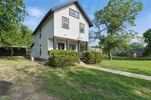 903 North Miller Street Decatur, TX 76234 - Photo 1 of 15 Rear view of property featuring a yard