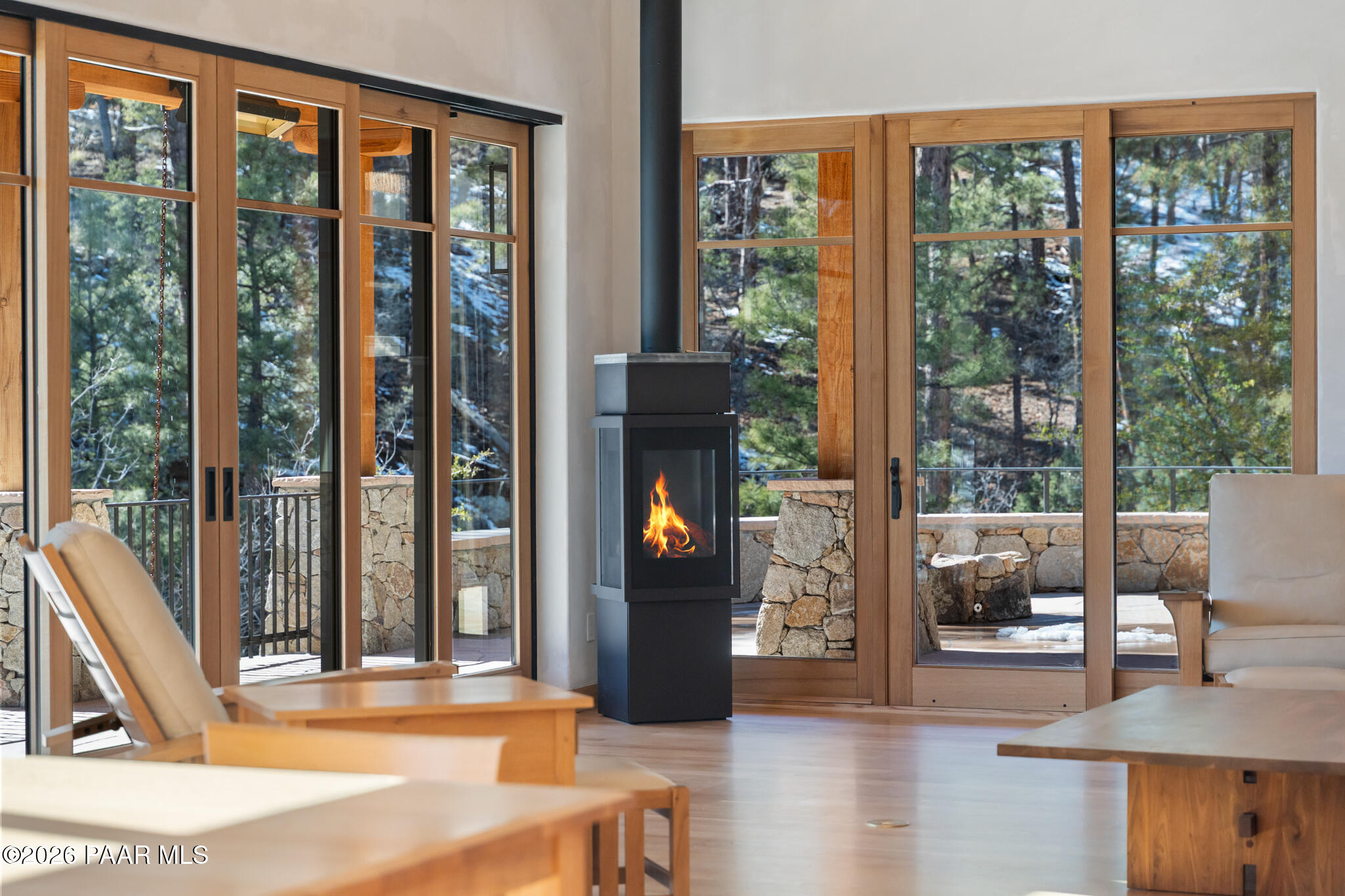 1090 High Valley Ranch Road Prescott, AZ 86303 - Photo 21 of 65 a living room with a large window and a wooden floor