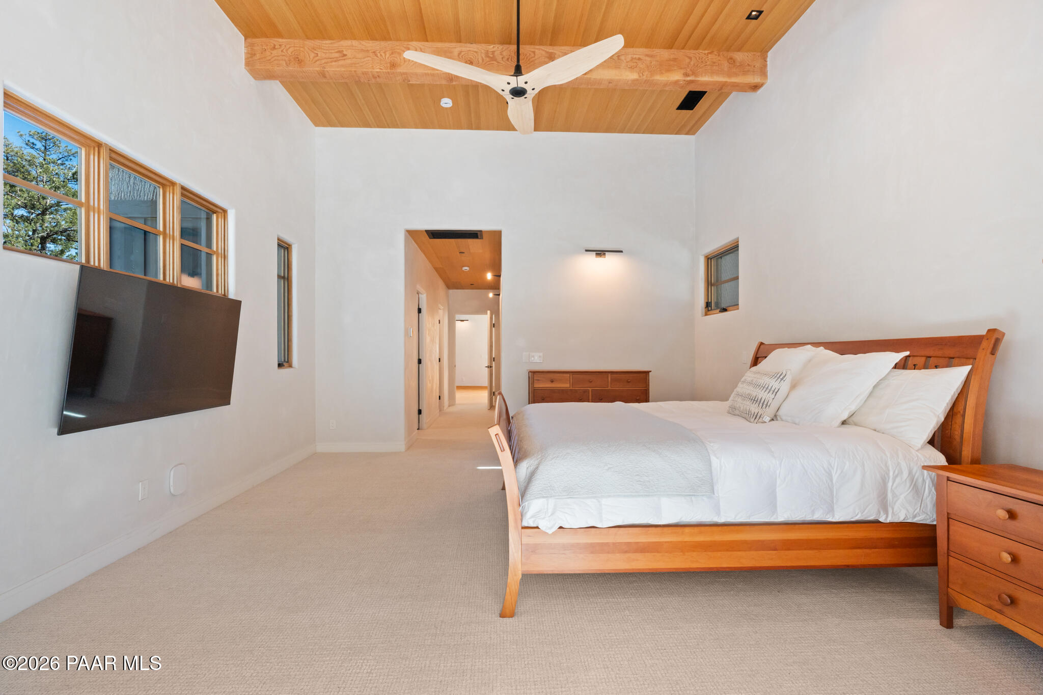 1090 High Valley Ranch Road Prescott, AZ 86303 - Photo 29 of 65 a bedroom with a bed and a flat screen tv