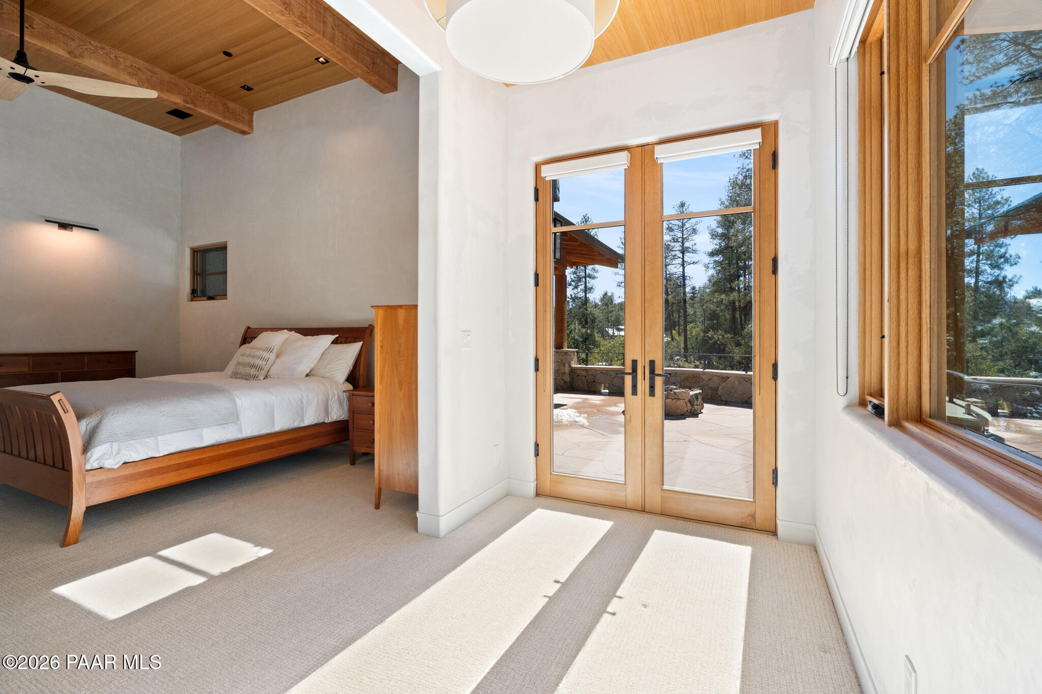 1090 High Valley Ranch Road Prescott, AZ 86303 - Photo 30 of 65 a bedroom with a bed and a large window