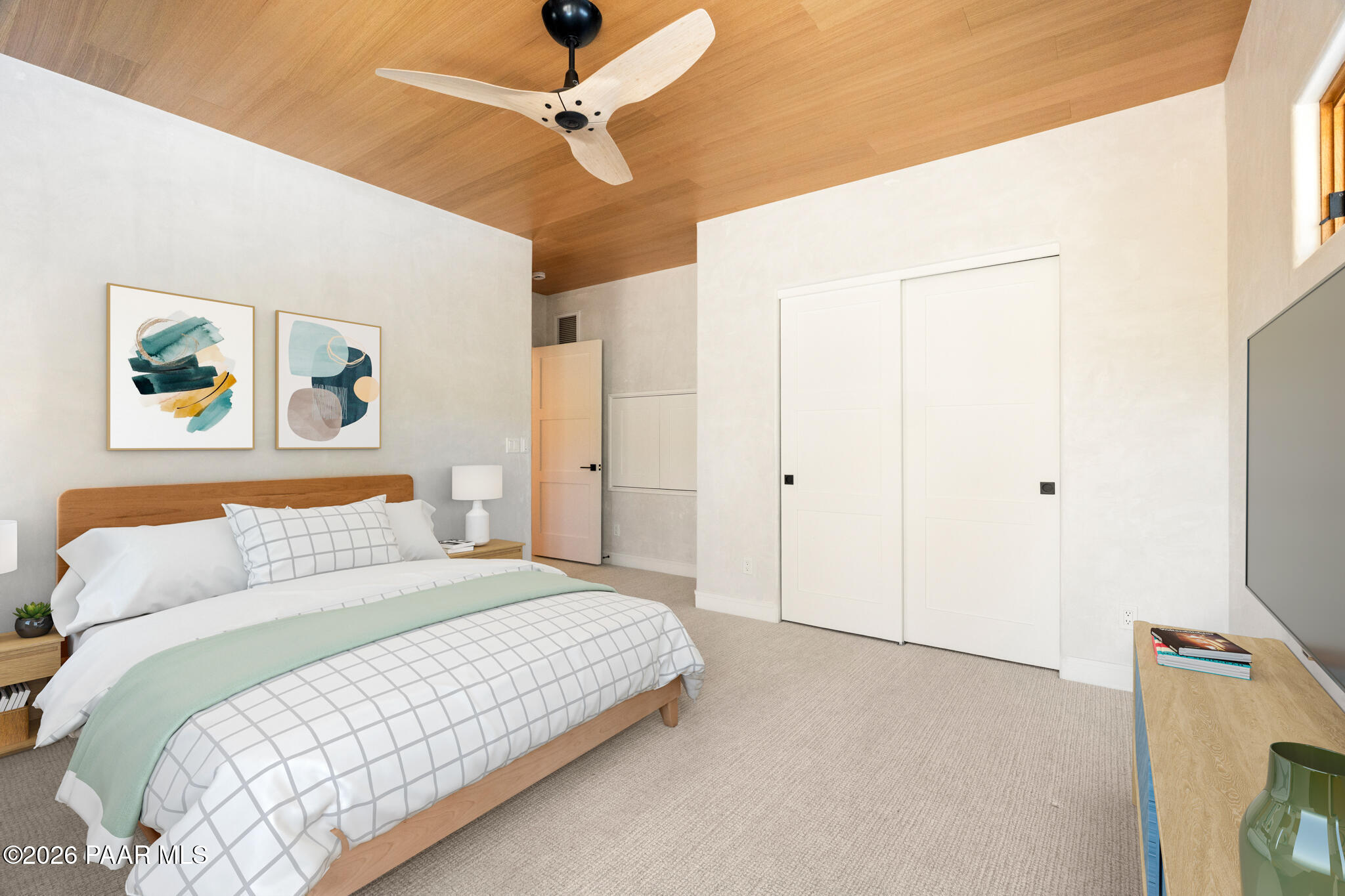 1090 High Valley Ranch Road Prescott, AZ 86303 - Photo 36 of 65 a bedroom with a bed and a chandelier