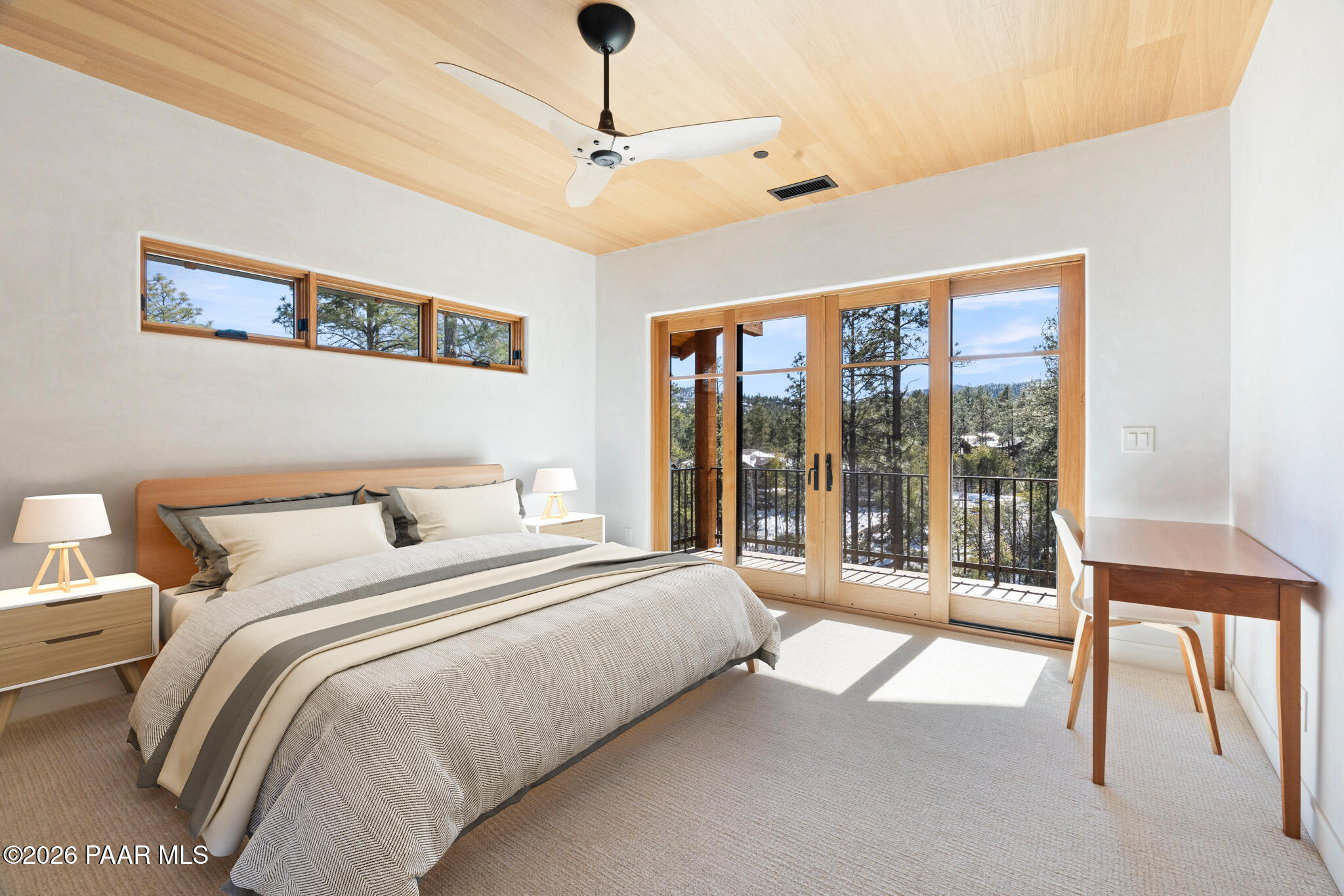 1090 High Valley Ranch Road Prescott, AZ 86303 - Photo 39 of 65 a bedroom with a large bed and a large window