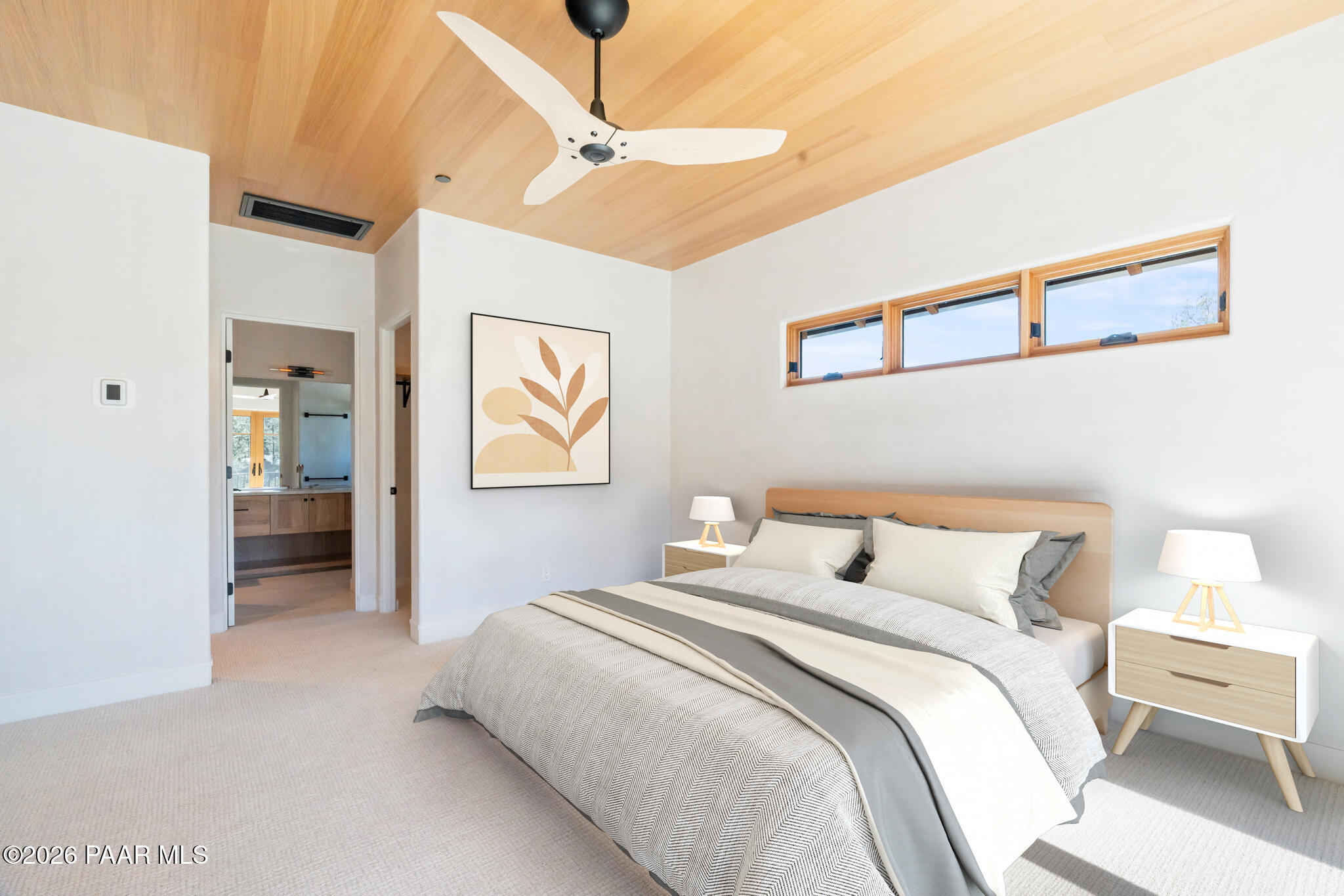 1090 High Valley Ranch Road Prescott, AZ 86303 - Photo 40 of 65 a bedroom with a bed and a view of bathroom