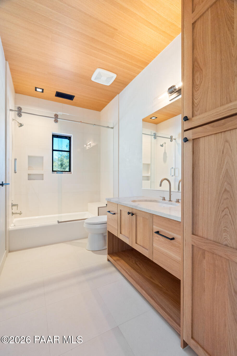 1090 High Valley Ranch Road Prescott, AZ 86303 - Photo 43 of 65 a bathroom with a double vanity sink a mirror and a bathtub